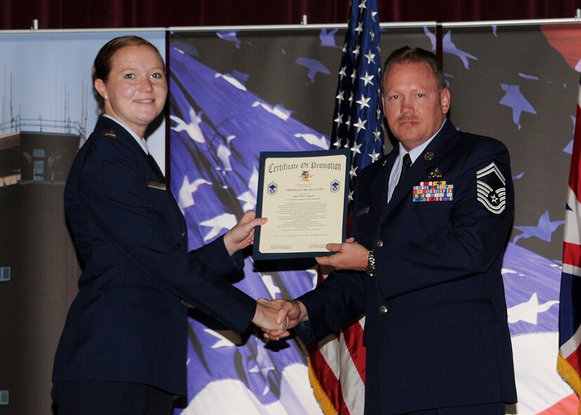 Master Sgt. Thomas L. McAnallen is promoted to the rank of senior master sergeant by 2nd Lt. Micael E. Nash, from the 100th Maintenance Squadron, during the promotion ceremony held at the base theater Aug. 29, 2008, in RAF Mildenhall, England. (U.S. Air Force photo by Staff Sgt. Jerry Fleshman)