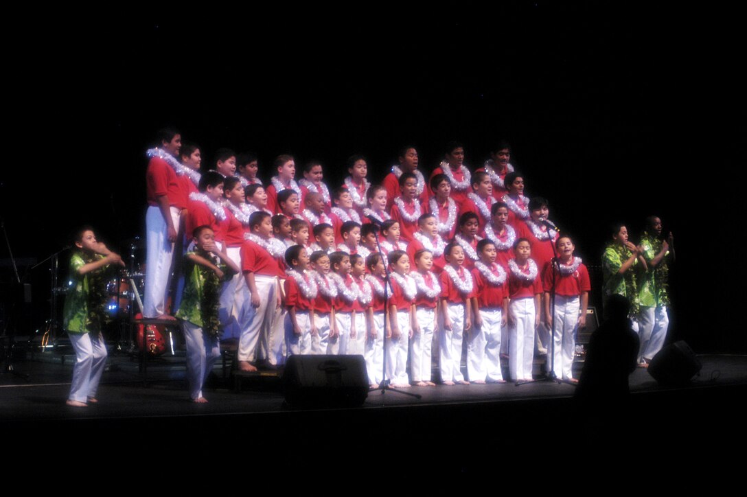 The Honolulu Boy Choir sing and dance to holiday music the Hawaiian way Dec. 10 during Na Mele o na Keiki, 'Music for the Children,' Toys for Tots concert which was presented by U.S. Marine  Corps Forces, Pacific and BAE Systems, a worldwide partner of the USO. The boys sang a variety of upbeat holiday songs for a crowd of more than 1,500 people.