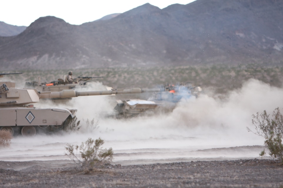 The tank of Maj. David Bardorf, the battalion executive officer for 1st Tank Battalion fires its main gun during the final exercise of the battalion’s combined arms exercise known as Steel Knight.  The battalion trained in conjunction with multiple other units Dec. 6 through 12.
