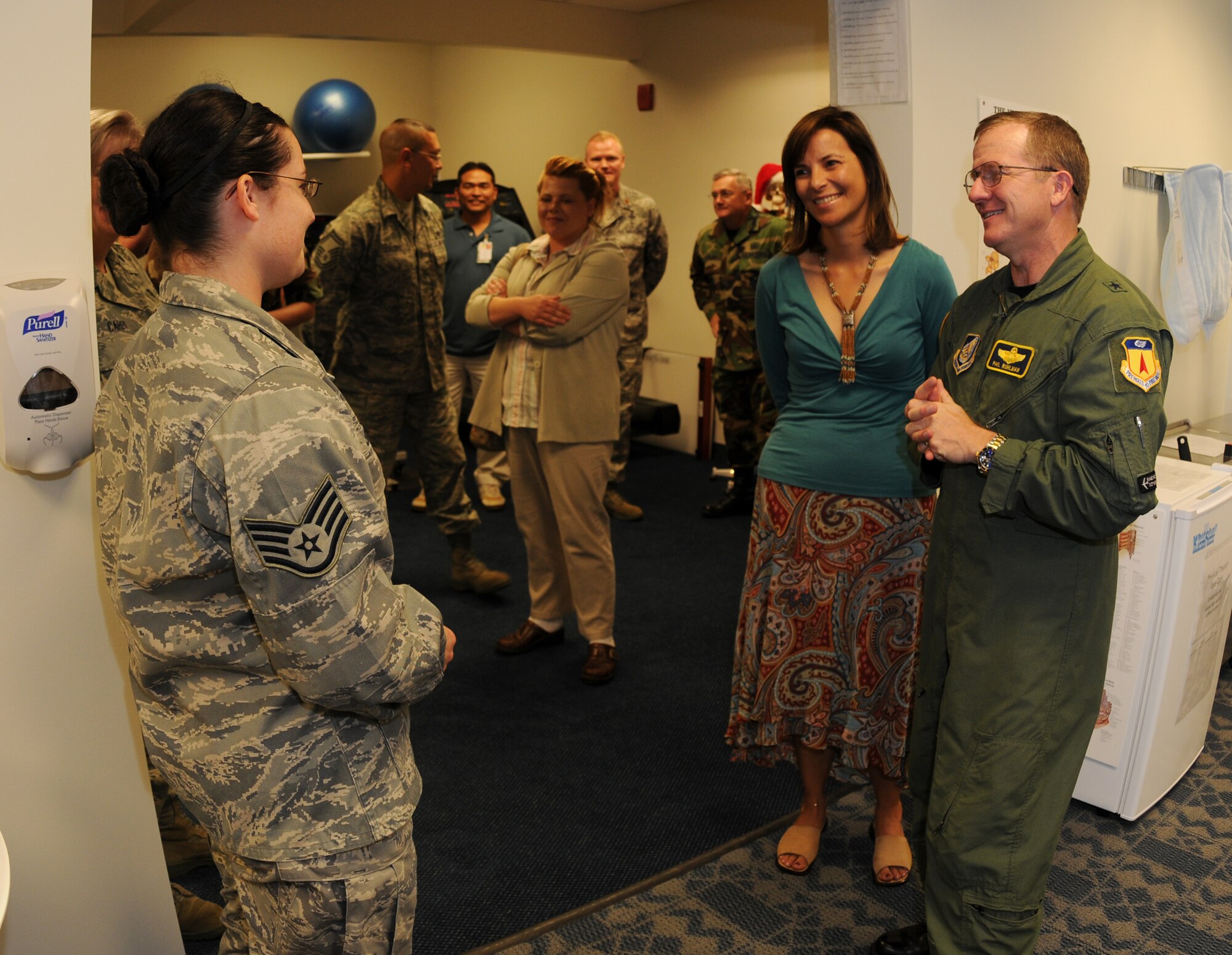 ANDERSEN AIR FORCE BASE, Guam - Staff Sgt. Rebecca Smen (left), of the 36th Medical Operations Squadron, answers questions from Brig. Gen. Phil Ruhlman, 36th Wing commander, and his wife Lina about the newly opened physical therapy clinic at the Health and Wellness Center Dec. 11.  Sergeant Smen is one of two physical therapy technicians who work at the new facility on Andersen. (U.S. Air Force photo by Senior Airman Jonathan Hart)