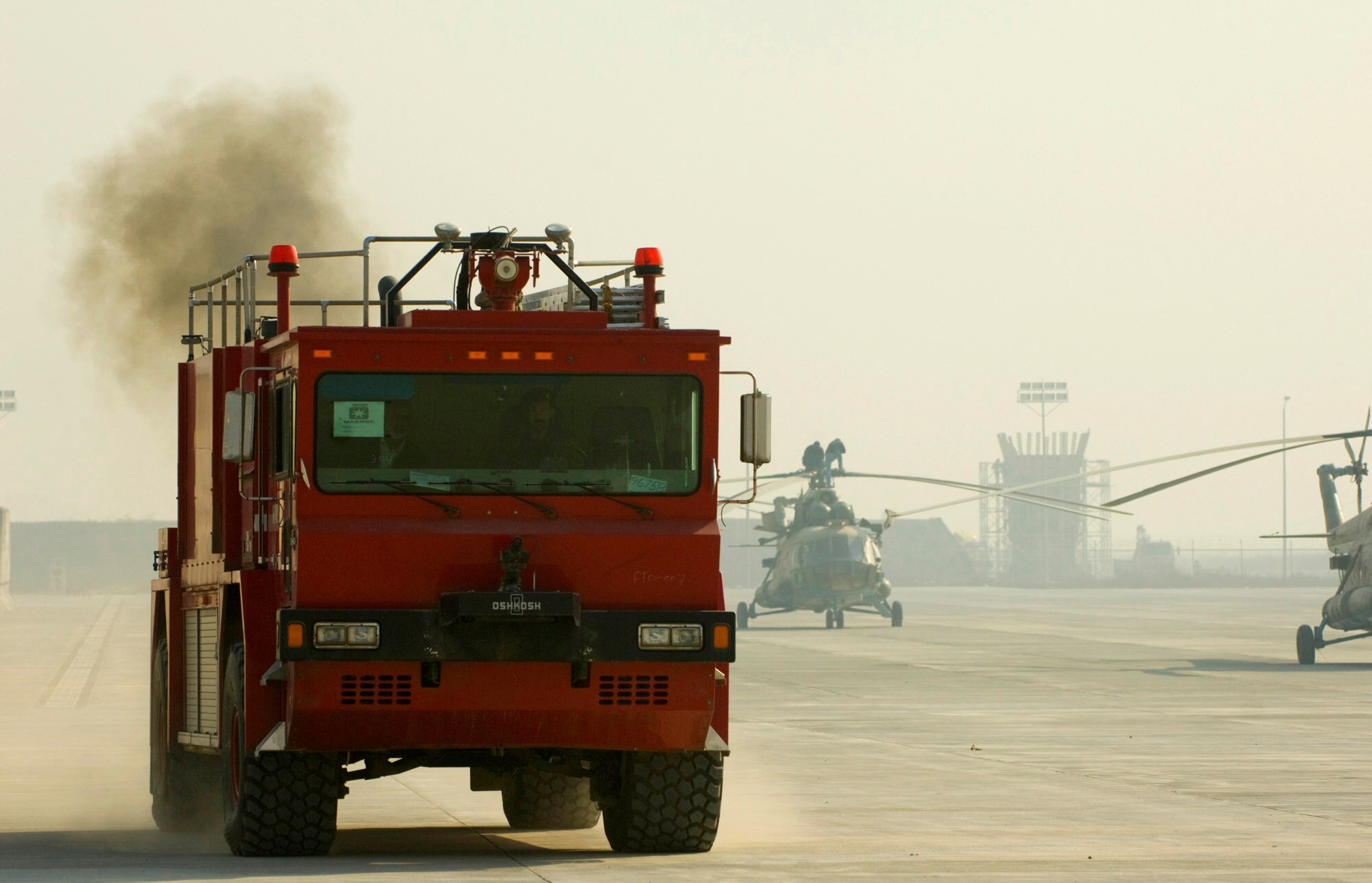 Afghan National Army Air Corps firefighters train on driving the Osh Kosh fire truck on the flightline at Kabul International Airport, Afghanistran. The ANAAC received seven of the fire trucks recently, which will be distributed to several bases around Afghanistan. (U.S. Air Force photo/Master Sgt. Keith Brown) 
