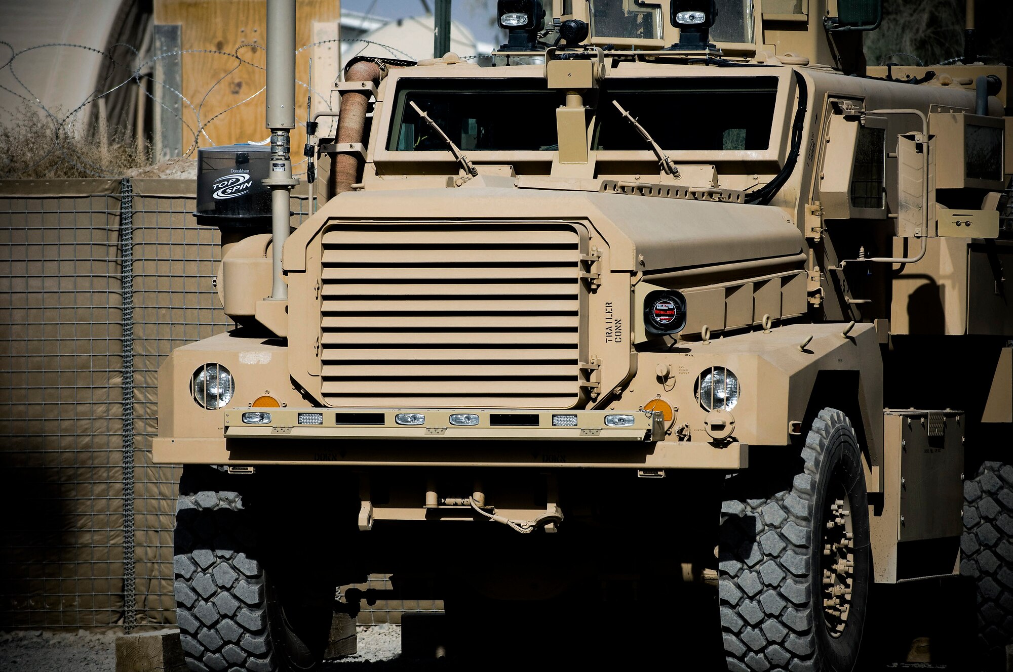 A mine-resistant, ambush-protected vehicle stands ready at the 755th Air Expeditionary Group Explosive Ordnance Disposal Operation Location-Bravo, Kandahar Air Field, Afghanistan. MRAPs provide a great deal of safety and security for EOD teams, incorporating thick armor and a V-shaped hull to deflect blasts away from passengers. (U.S. Air Force photo/Staff Sgt. Samuel Morse) 
