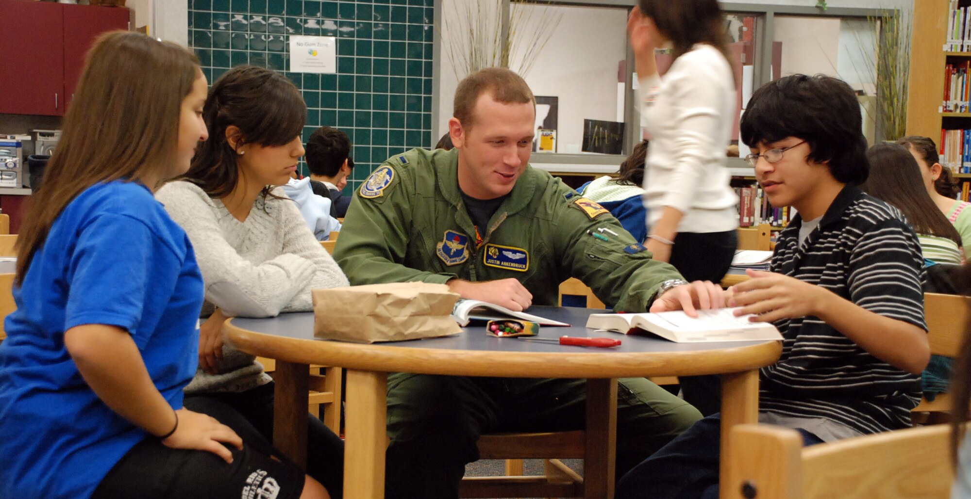 LAUGHLIN AIR FORCE BASE, Texas – Instructor pilot 1st Lt. Justin Ankenbruck, 85th Flying Training Squadron, tutors a group of Del Rio Middle School students in preparation for the Texas Assessment of Knowledge and Skills test.  Several IPs from all over Laughlin volunteer on a regular basis to tutor children at local schools.  (U.S. Air Force photo by Staff Sgt. Austin M. May)