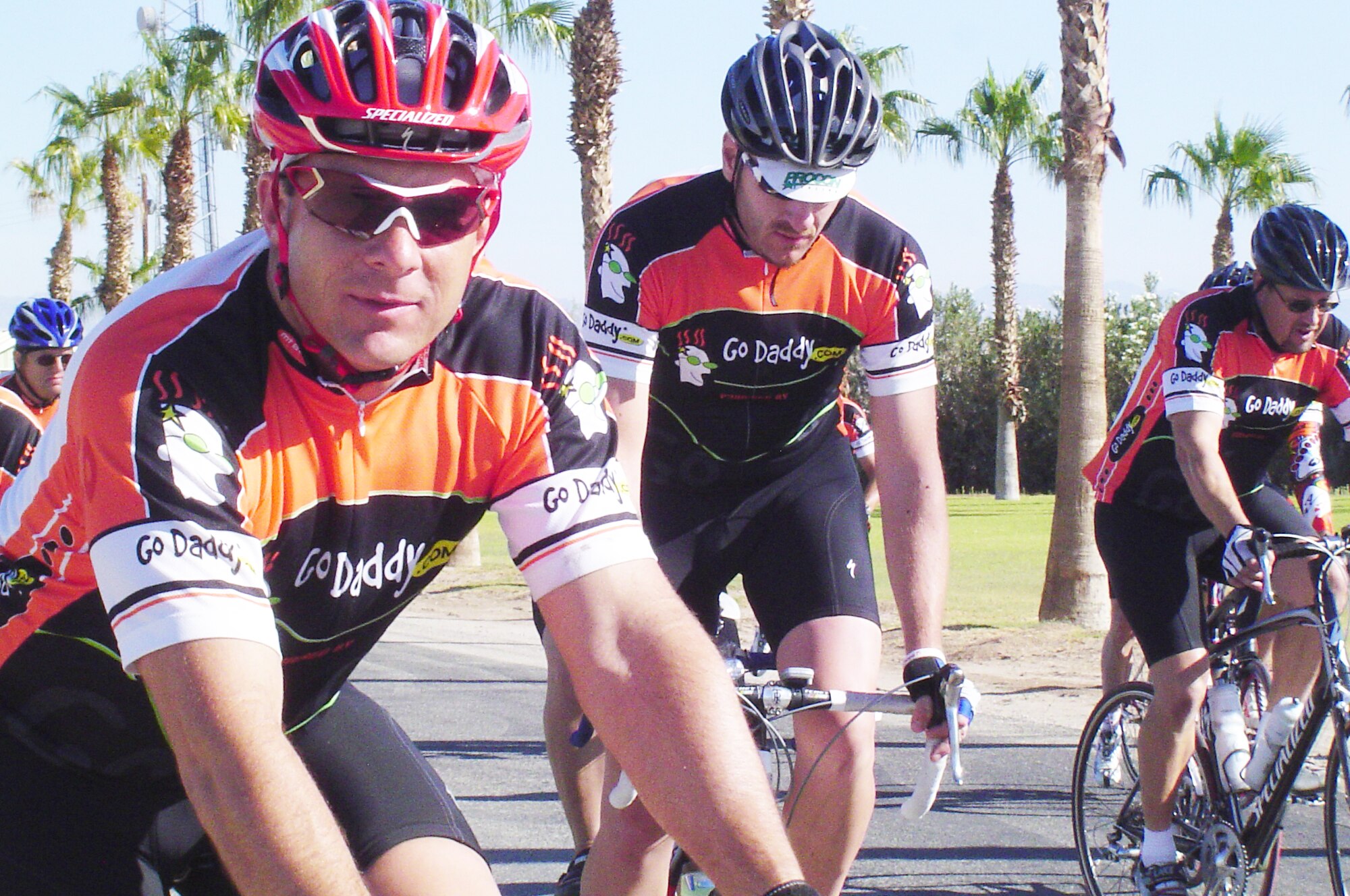 Lt. Col. Paul Thompson, 729 AS (left) and fellow cyclists sport jerseys donated by Bob Parsons, founder and CEO of Go Daddy.com.  Parsons is a former Marine Vietnam veteran. (Photos courtesy of Lt. Col. Paul Thompson)
