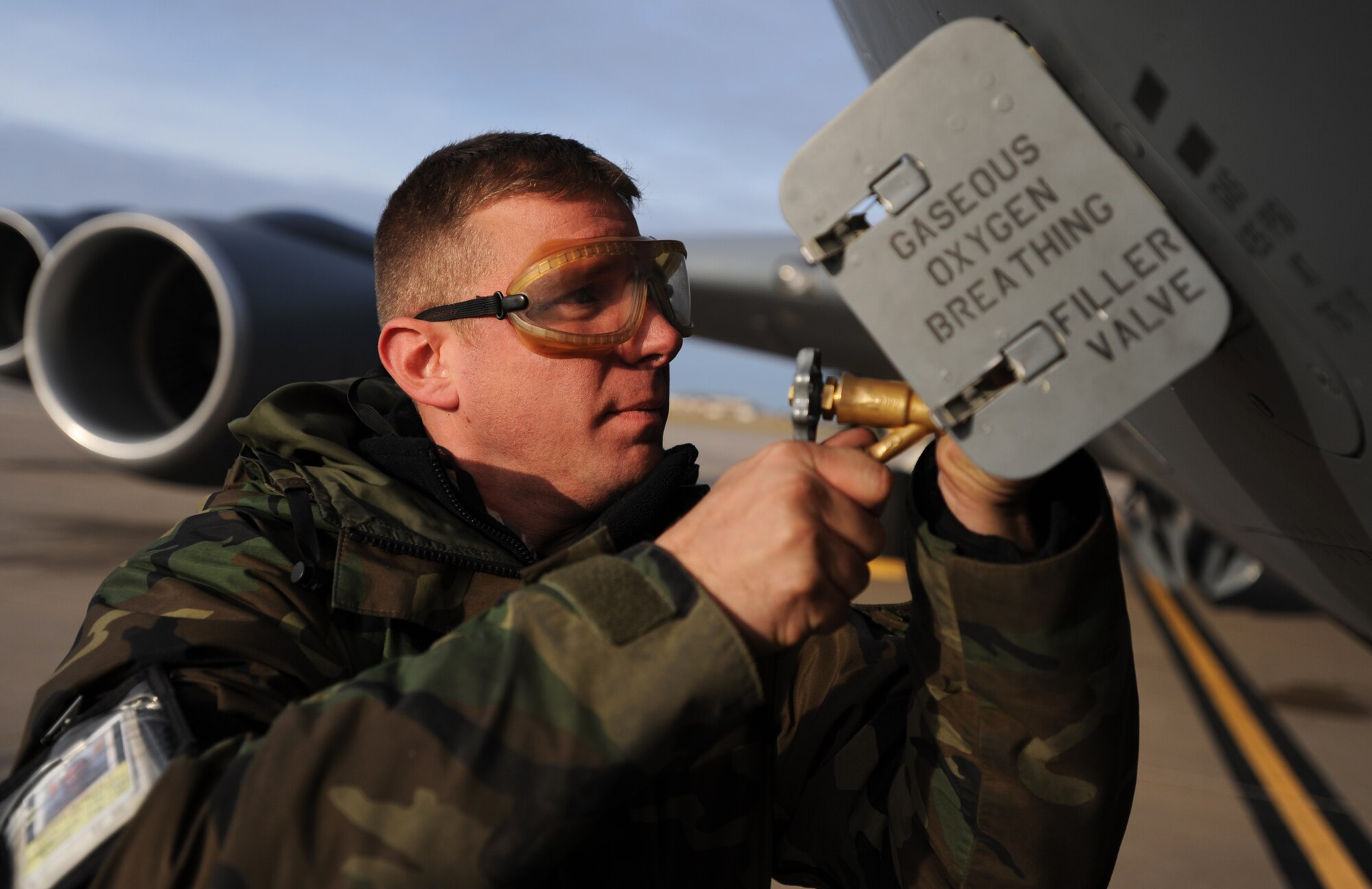 Tech. Sgt. Greg Mitchell pumps oxygen into a KC-135 Stratotanker during the 931st Air Refueling Group's unit training assembly in December. Sergeant Mitchell, a crew chief assigned to the 931st Aircraft Maintenance Squadron, recently was honored by the 22nd Air Refueling Wing for his job performance. The 22nd ARW is the 931st ARG's active-duty host unit at McConnell Air Force Base, Kan. The 931st ARG is an Air Force Reserve unit. (U.S. Air Force photo/Tech. Sgt. Jason Schaap)