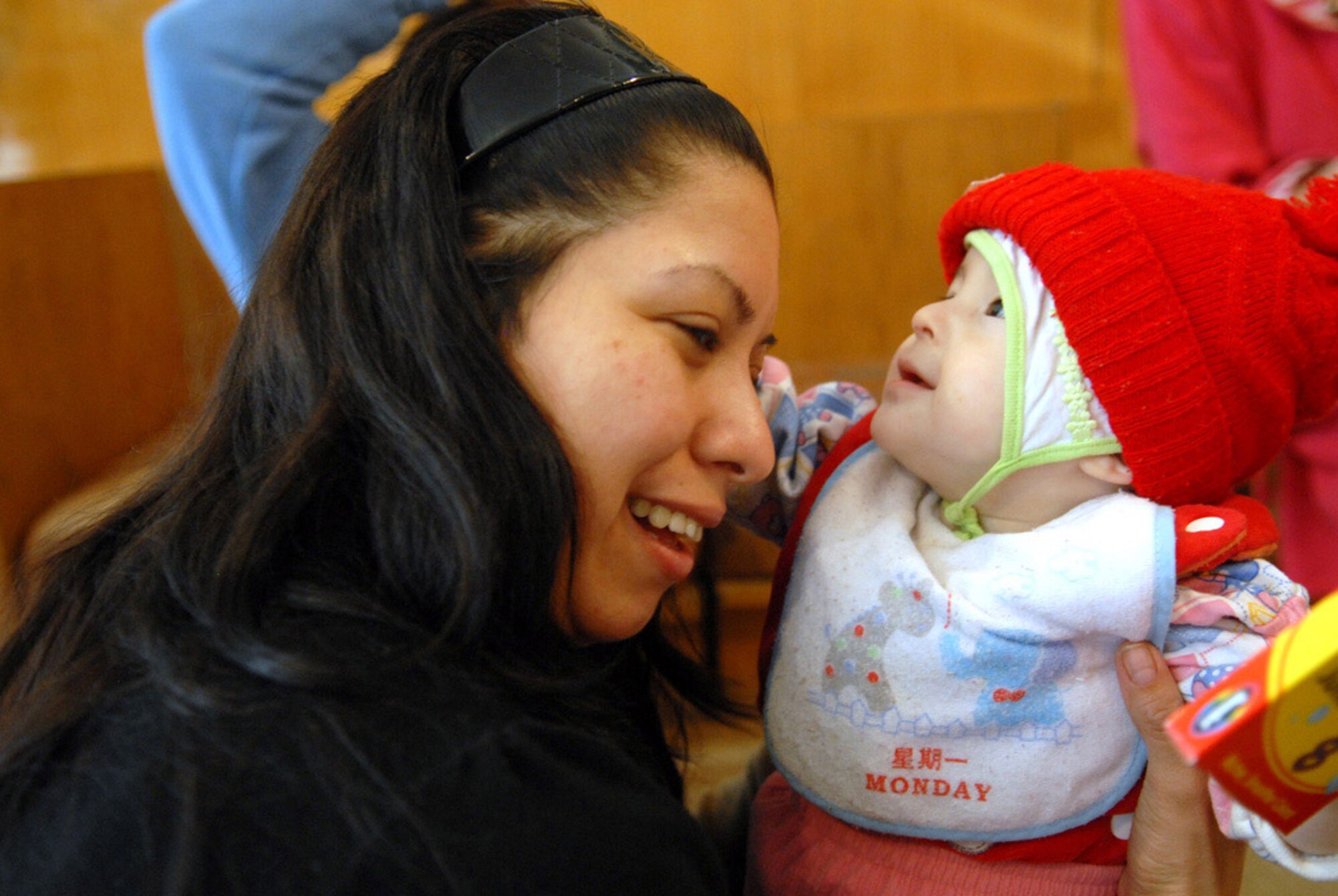 Senior Airman Sonya Deleon plays with a child who is awaiting heart surgery Dec. 3 in Bishkek, Kyrgyzstan. Over the past five years, $71,680 of contributions from base Airmen have funded heart operations on 128 children at the Bishkek hospital. Airman Deleon is assigned to the 376th Expeditionary Force Support Squadron. (U.S. Air Force photo/Senior Airman Ruth Holcomb) 
