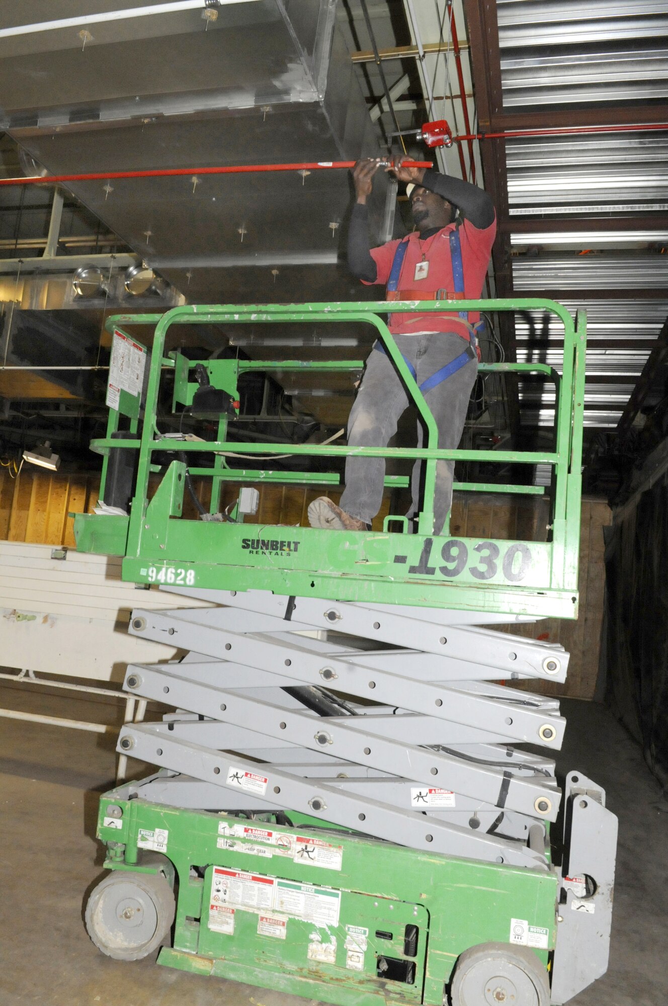 Jody Forehand installs conduit in the renovation area of bldg. 640. U. S. Air Force photo by Sue Sapp