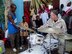 Master Sgt. Robert Green, percussionist with the Air Force Band of Flight Wright Brass Quintet, performs a drum solo with the help of a local boy at the Douda School while deployed to Djibouti, Africa. Air Force band members have been deploying to U.S. Central Command areas of responsibility since 2004 to entertain troops and, more recently, to help in humanitarian and outreach efforts in places like Kyrgyzstan and Kenya. Sergeant Green and the Band of Flight are part of Air Force Materiel Command. The Band of Flight is located at Wright-Patterson Air Force Base, Ohio. (Air Force photo by 2nd Lt. Jason Plosch)