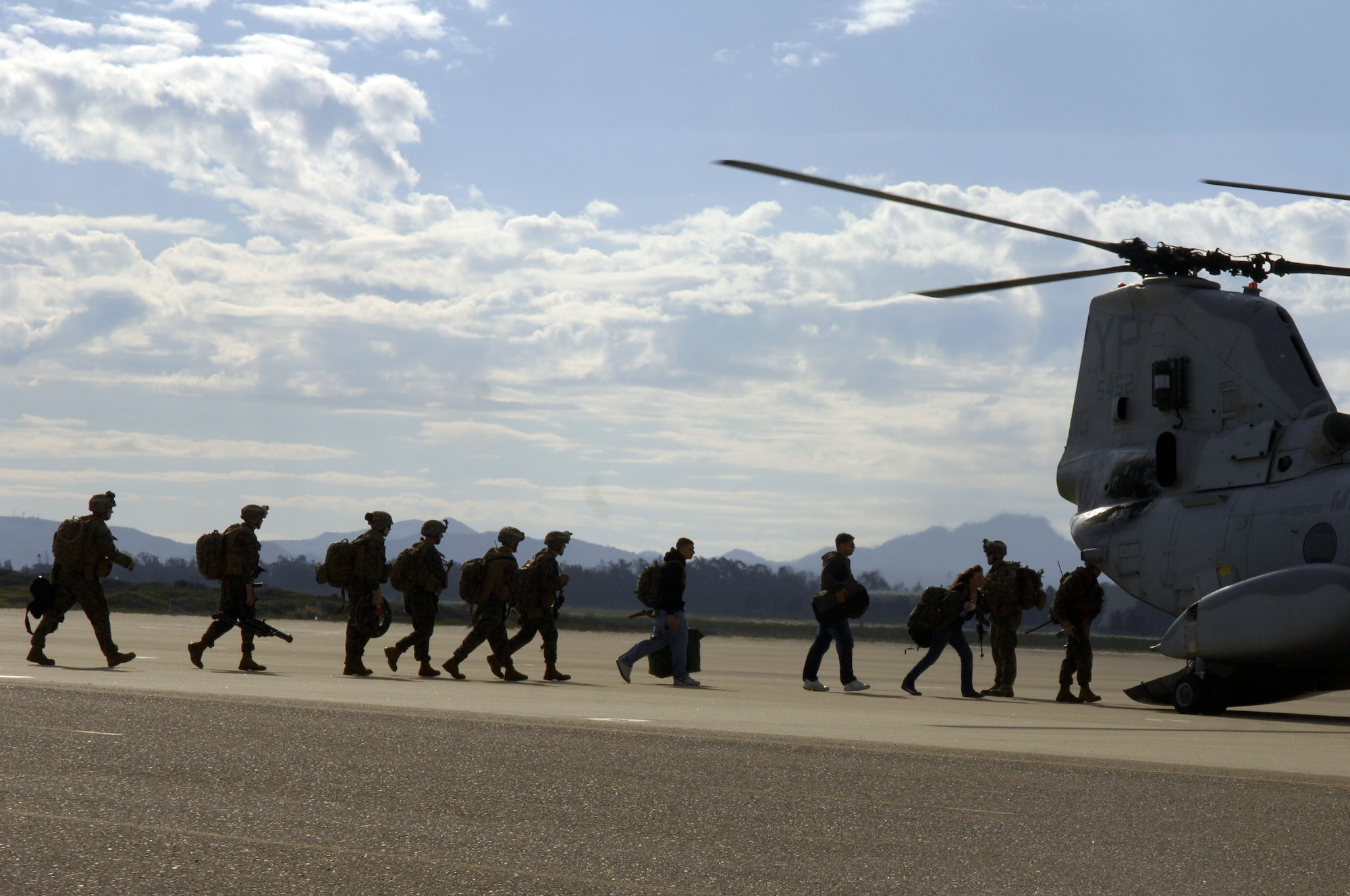 VANDENBERG AIR FORCE BASE, Calif. -- Marines from the 13th Marine Expeditionary Unit evacuate civilians during a simulated non-combatant evacuation operation Sunday. An MEU in recent events successfully pulled out American citizens during a conflict in Lebanon. The team’s effort in Lebanon has increased the awareness of the military to be ready for the need of non-combatant evacuations in foreign countries when they become unsafe for Americans and our allies. (U.S. Air Force photo/Senior Airman Matthew Plew)