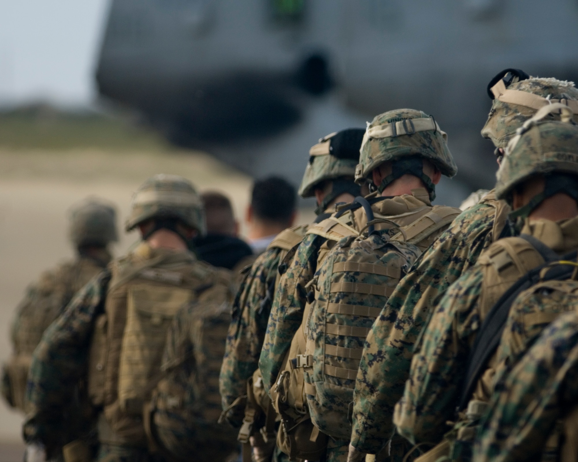 VANDENBERG AIR FORCE BASE, Calif. -- Marines from the 13th Marine Expeditionary Unit evacuate civilians during a simulated non-combatant evacuation operation Sunday. An MEU in recent events successfully pulled out American citizens during a conflict in Lebanon. The team’s effort in Lebanon has increased the awareness of the military to be ready for the need of non-combatant evacuations in foreign countries when they become unsafe for Americans and our allies. (U.S. Air Force photo/Staff Sergeant Vanessa Valentine)