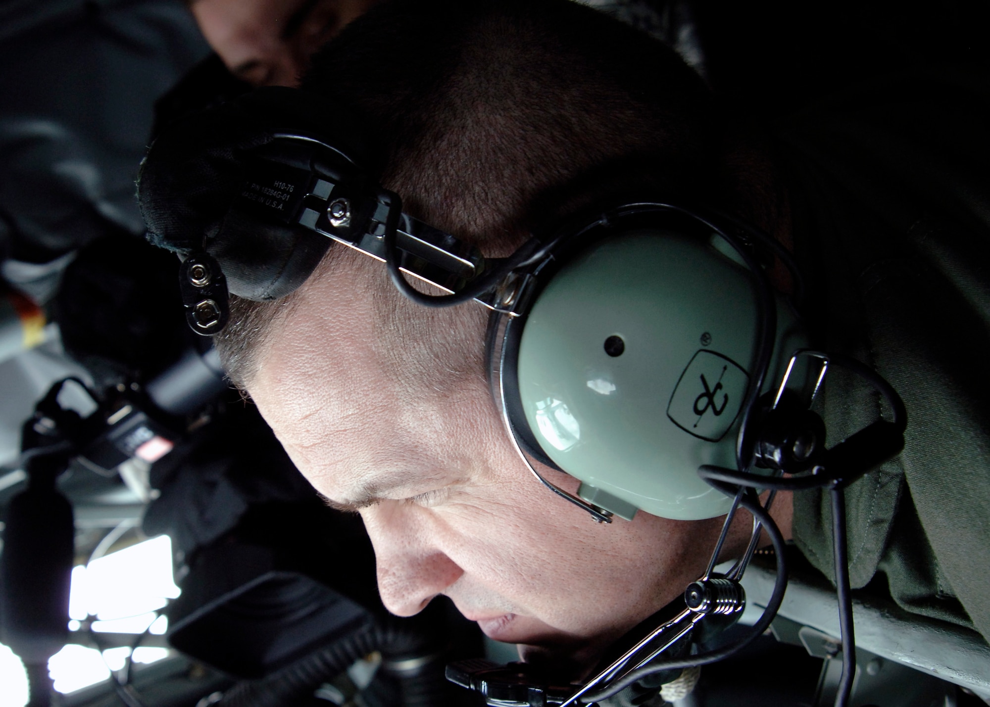 MCCONNELL AIR FORCE BASE, Kan. -- Master Sgt. Paul Wallace, 22nd Operations Group boom operator, focuses on guiding the boom to the C-5M Super Galaxy test aircraft from a Lockheed Martin facility in Marietta, Ga., Dec. 3. (Photo by Senior Airman Anthony Mejia)