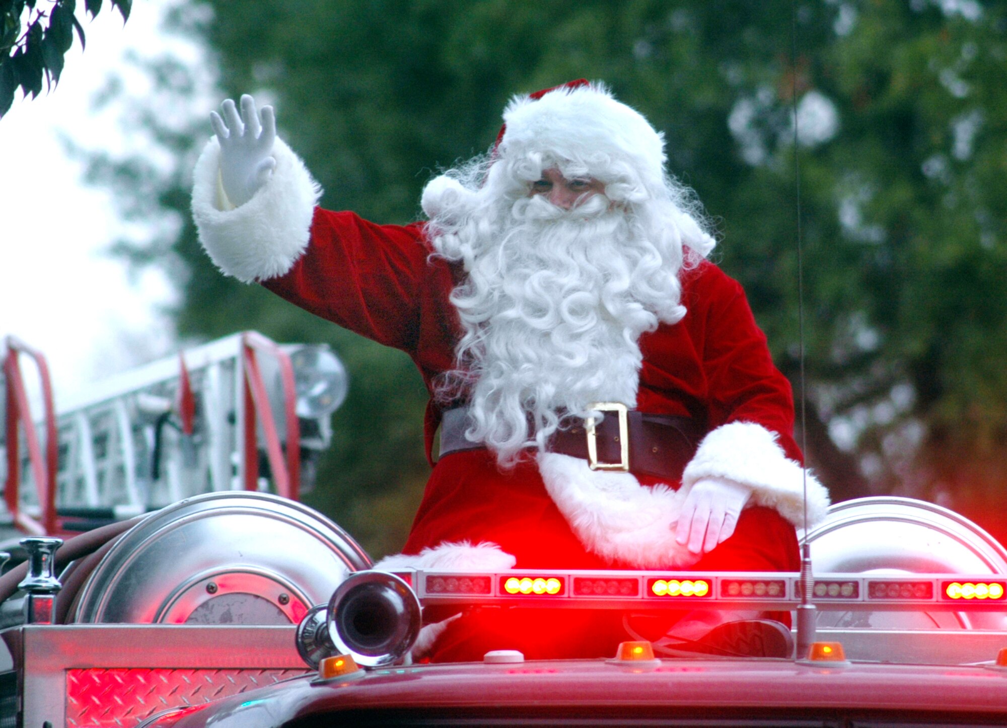 Santa Claus waves to the crowd from atop a fire truck during Perry's "The Magic of Christmas" parade Dec. 6. U. S. Air Force photo by Sue Sapp