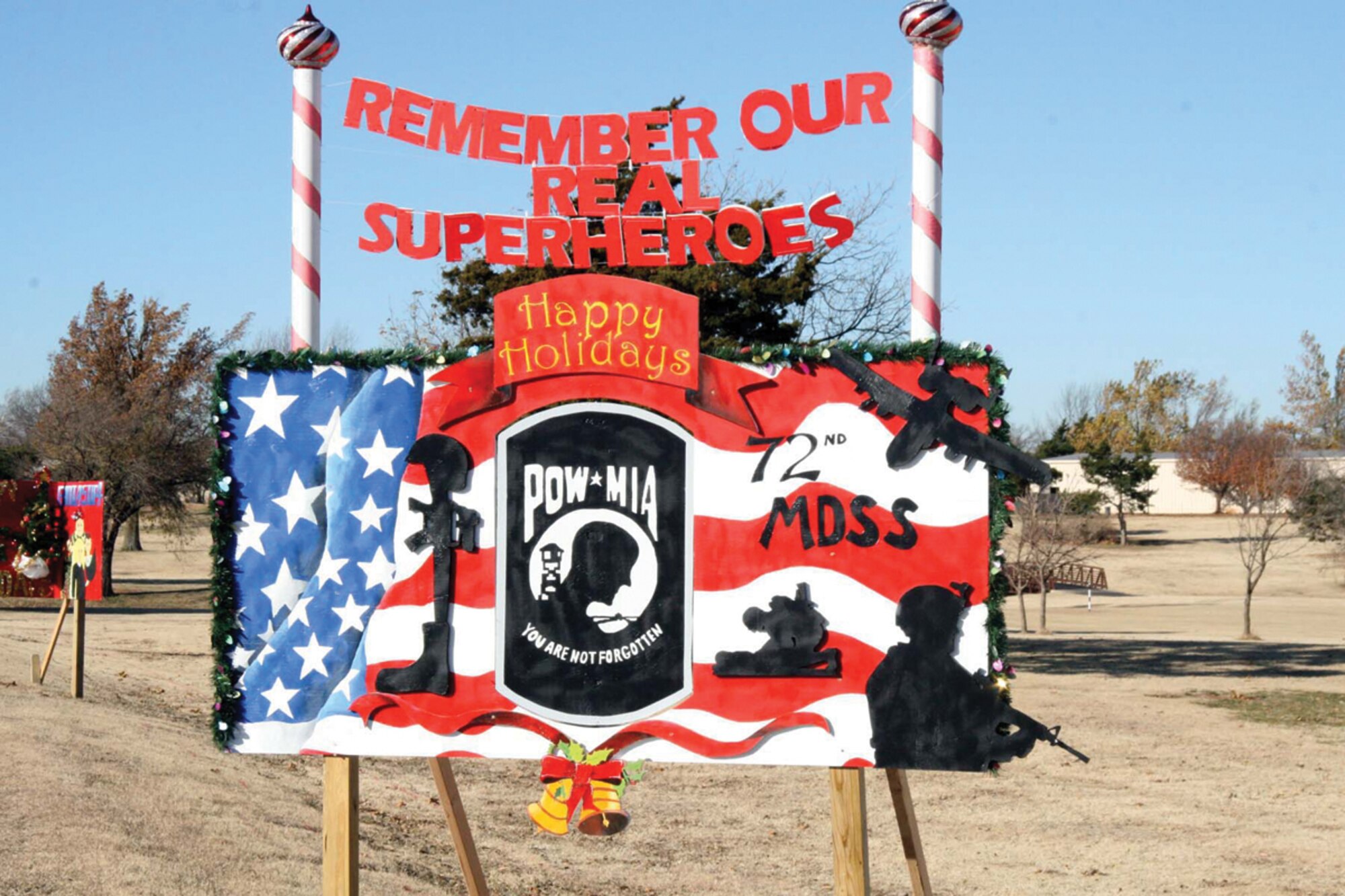 Tinker squadrons spread holiday cheer to all Team Tinker with cards that line the northeast side of Arnold Street by the Tinker Golf Course. Squadrons competed for first through fourth place prizes and honorable mention. The 72nd Medical Support Squadron won $400 for their first place entry.(Air Force photo/Becky Pilifant)
