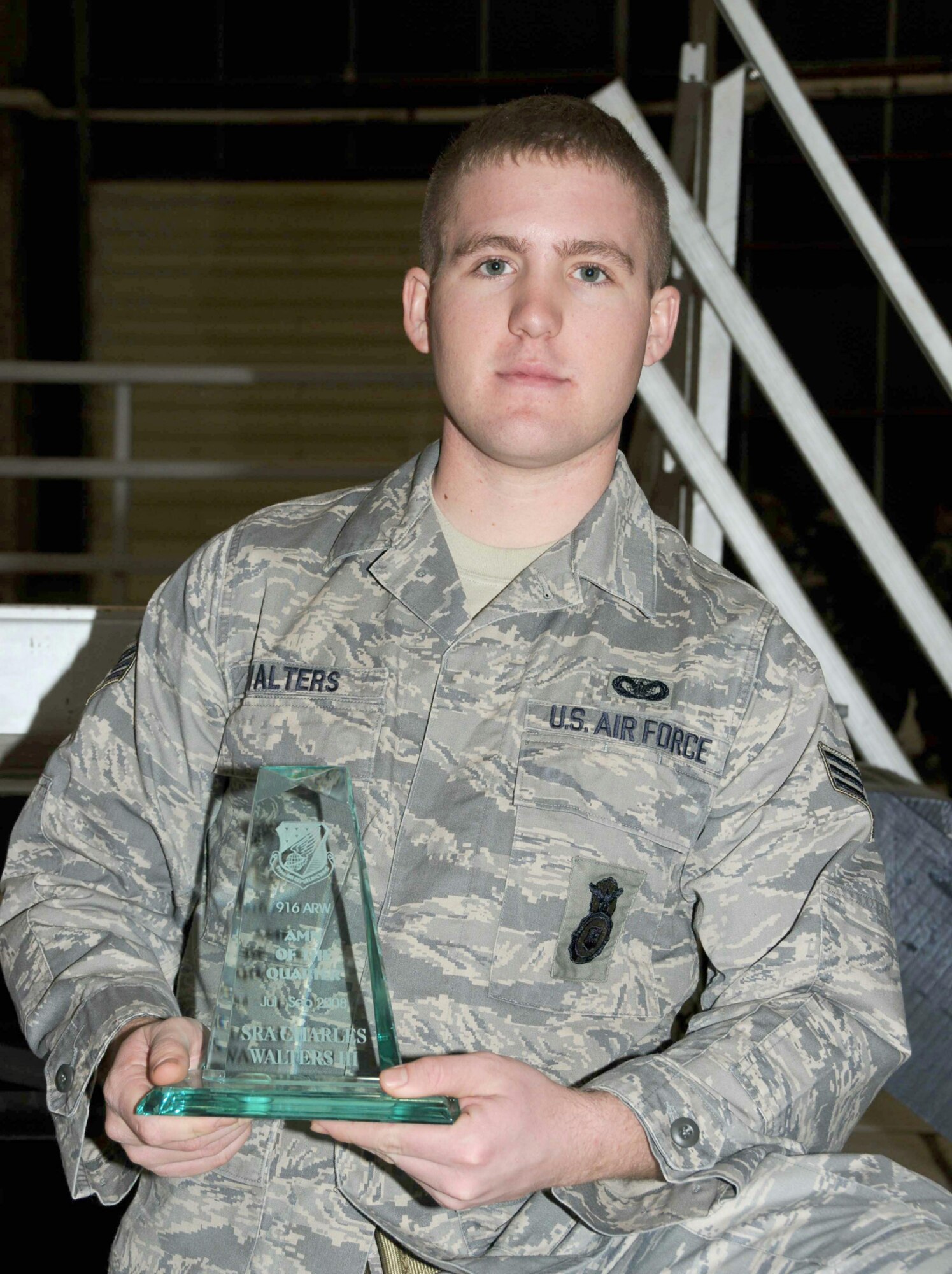 SEYMOUR JOHNSON AIR FORCE BASE, N.C. -- Senior Airman Charles Walters, III poses with his award for 916th Air Refueling Wing Airman of the Quarter. Airman Walters is a volunteer firefighter with the Stony Hill Rural Fire Dept. and is assisting with the department's Christmas drive to support deployed troops and their families.