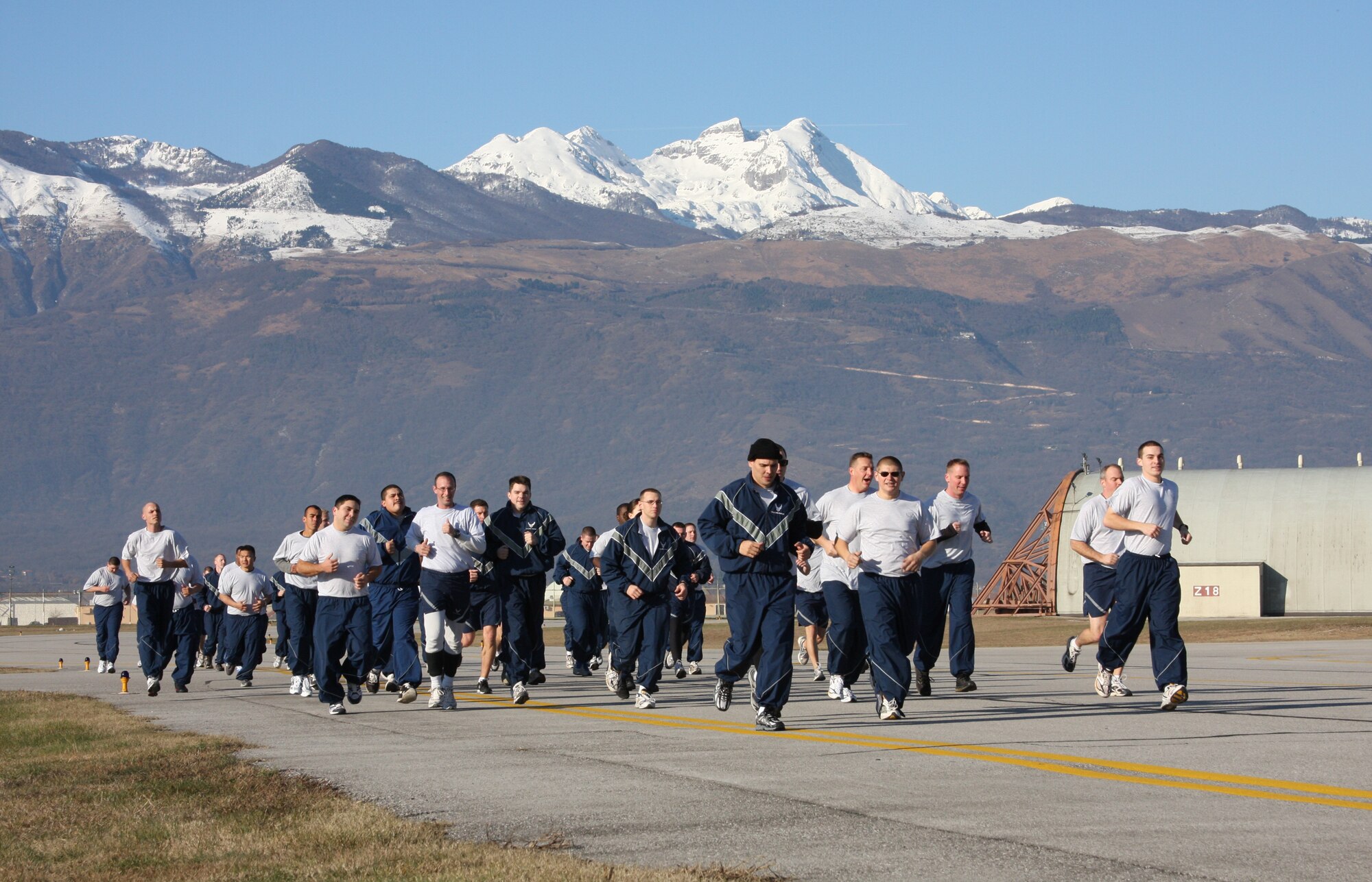 Members of the 31st Aircraft Maintenance Squadron run 2.5 miles as part of Air Force Wingman Day Dec. 8. Airmen from across the 31st Fighter Wing took time off of their daily work schedules to strenghten unit morale, improve co-worker relationships and focus on key Air Force issues including suicide prevention and sexual assault prevention. Activities included an Airmen's call, unit commanders' calls, and unit physical training sessions. (U.S. Air Force photo/Master Sgt. Christopher Sawaryn)