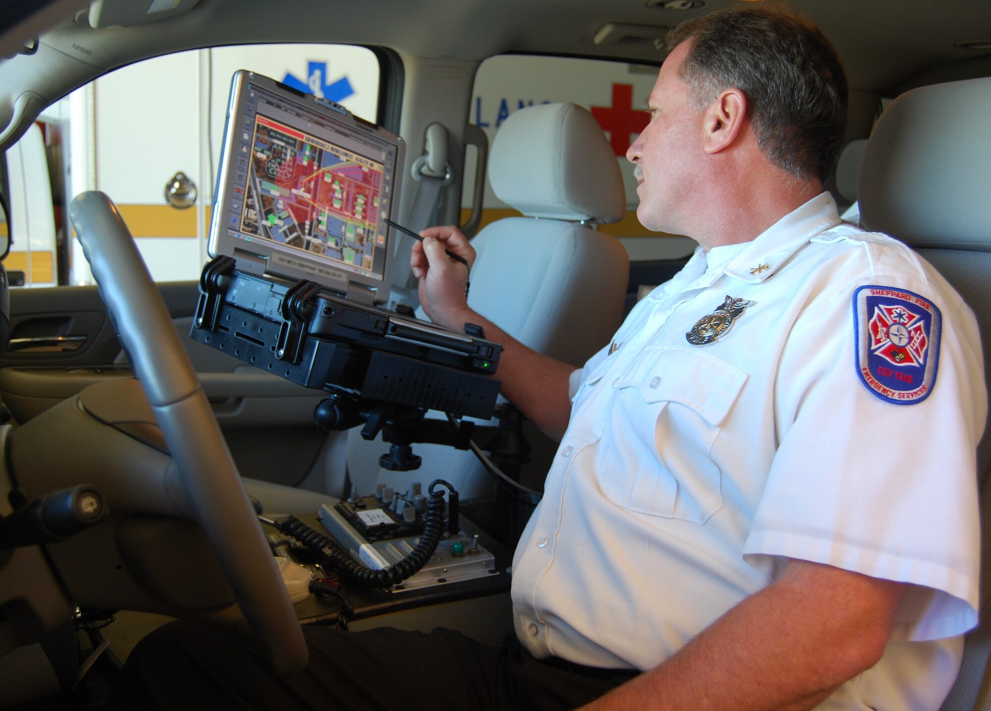 Deputy Fire Chief Mark Vroom analyzes danger areas for a simulated alarm on Sheppard's Monico alarm receiver Nov.25.