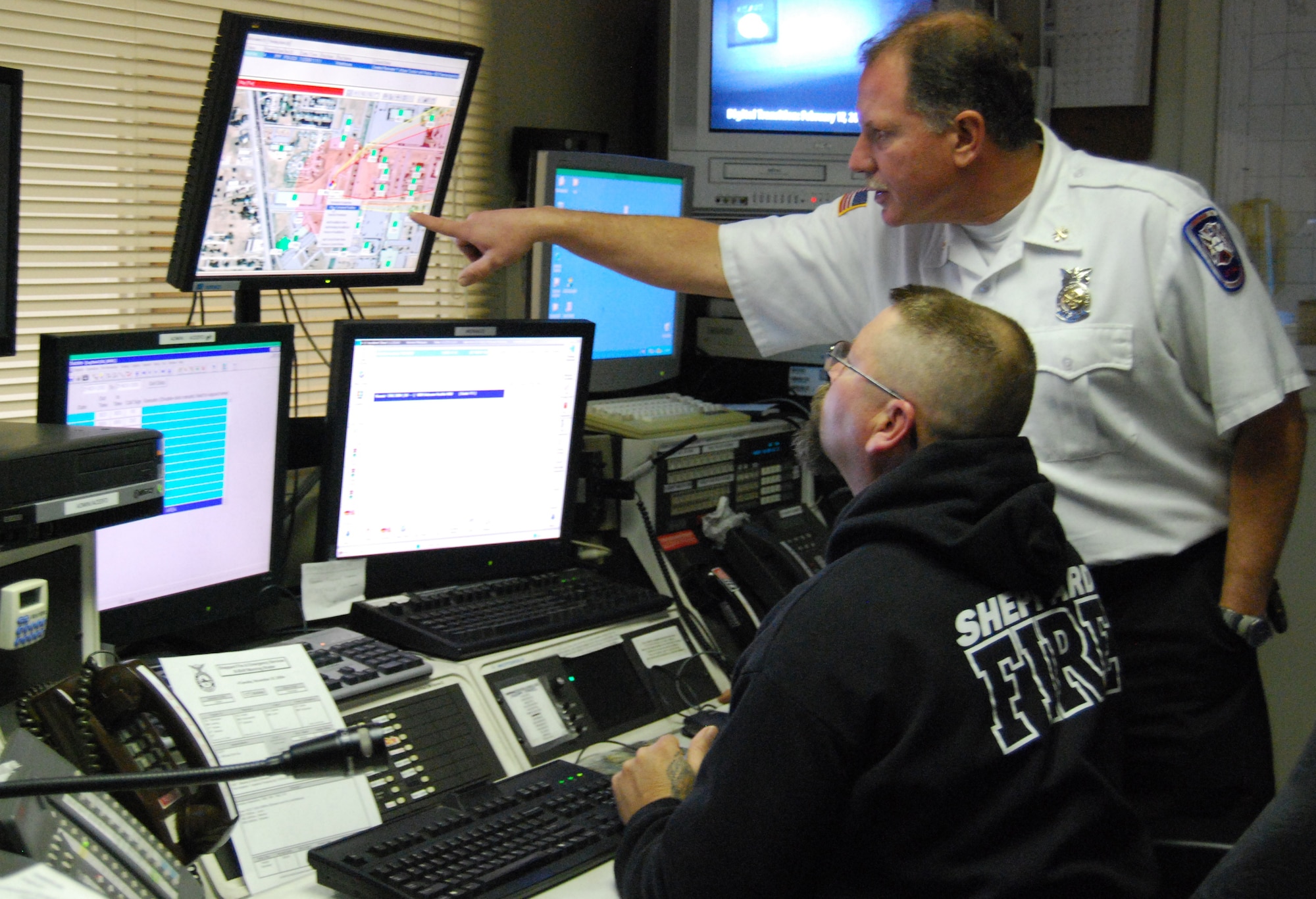 Deputy Fire Chief Mark Vroom analyzes danger areas for a simulated alarm on Sheppard's Monico alarm receiver Nov.25.