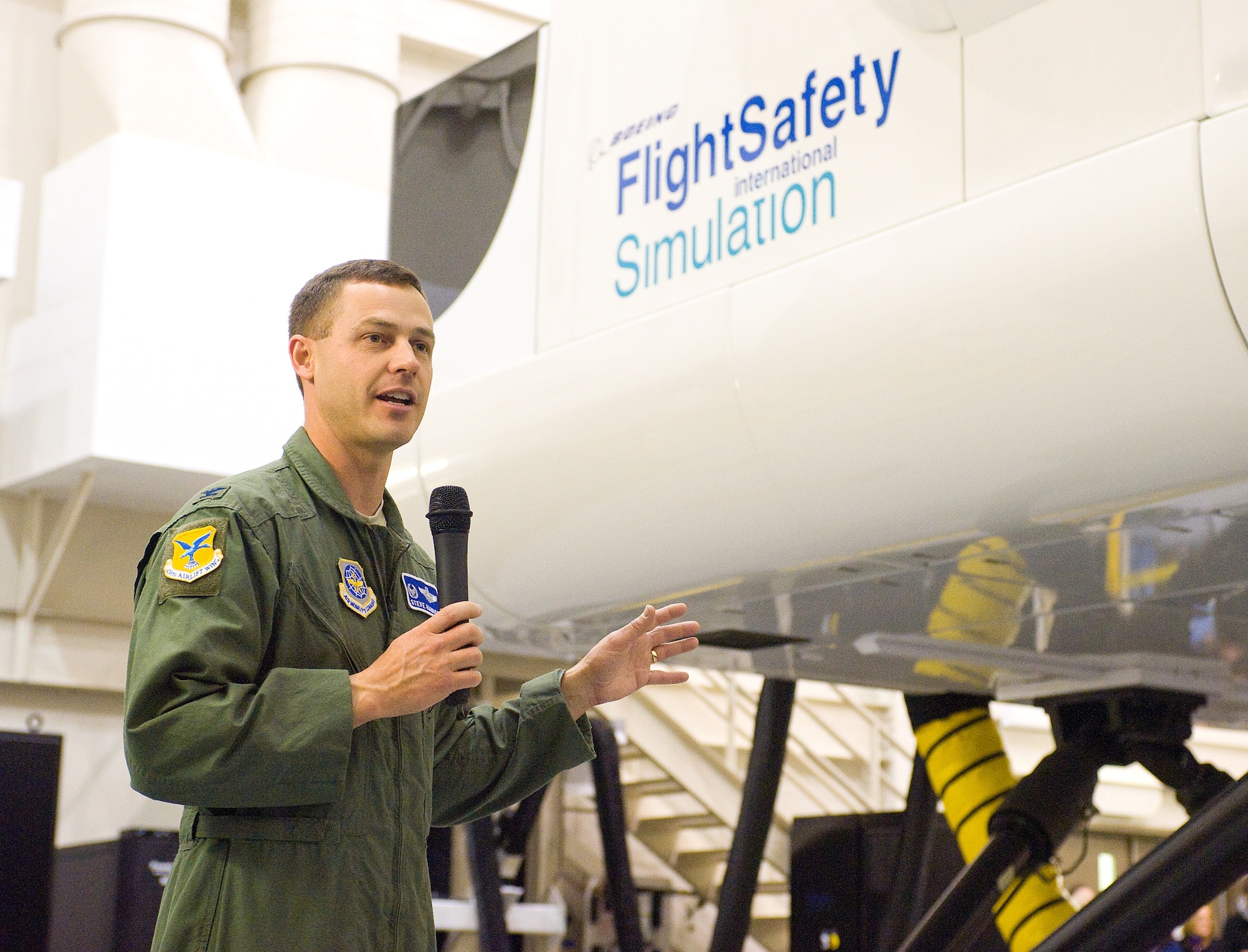 Col. Steven Harrison, 436th Airlift Wing commander, welcomes the crowd during the ribbon-cutting ceremony for the new C-17 Globemaster III simulator facility Dec. 5.  The new facility allows pilots and loadmasters to perform their training at Dover instead of traveling to New Jersey or Mississippi to train. (U.S. Air Force photo by Tom Randle)