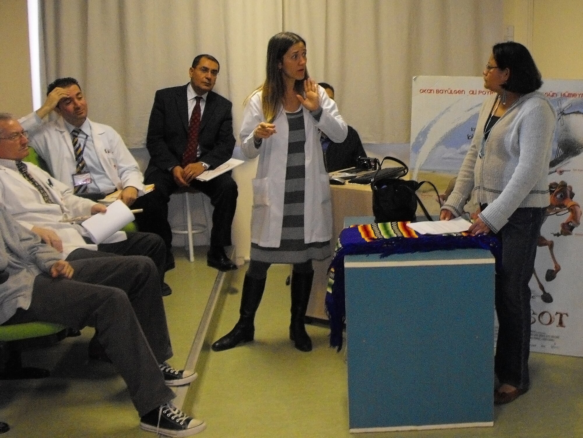 Tuba Bada, Gundogdu Liesesi school teacher, translates while Staff Sgt. Sharon Black (right) briefs an audience of approximately 50 high school students and teachers Dec. 3 at the Gundogdu Lisesi School in Adana. Sergeant Black's address focused on Native American culture, specifically the Navaho Nation. The brief was conducted to strengthen the bonds between 39th Air Base Wing and the local community. (Photo by Master Sgt. David Raines)