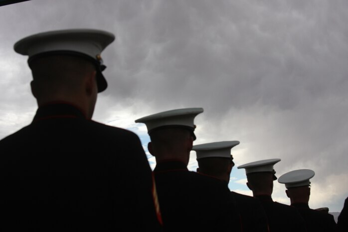 Overcast skies draped a somber scene during 2nd Battalion, 7th Marine Regiment's memorial service Dec. 12 at the Combat Center’s Lance Cpl. Torrey L. Gray Field.  Service members, family and friends joined together to pay their respects to their brothers and loved ones lost during 2/7’s recent deployment to Afghanistan.