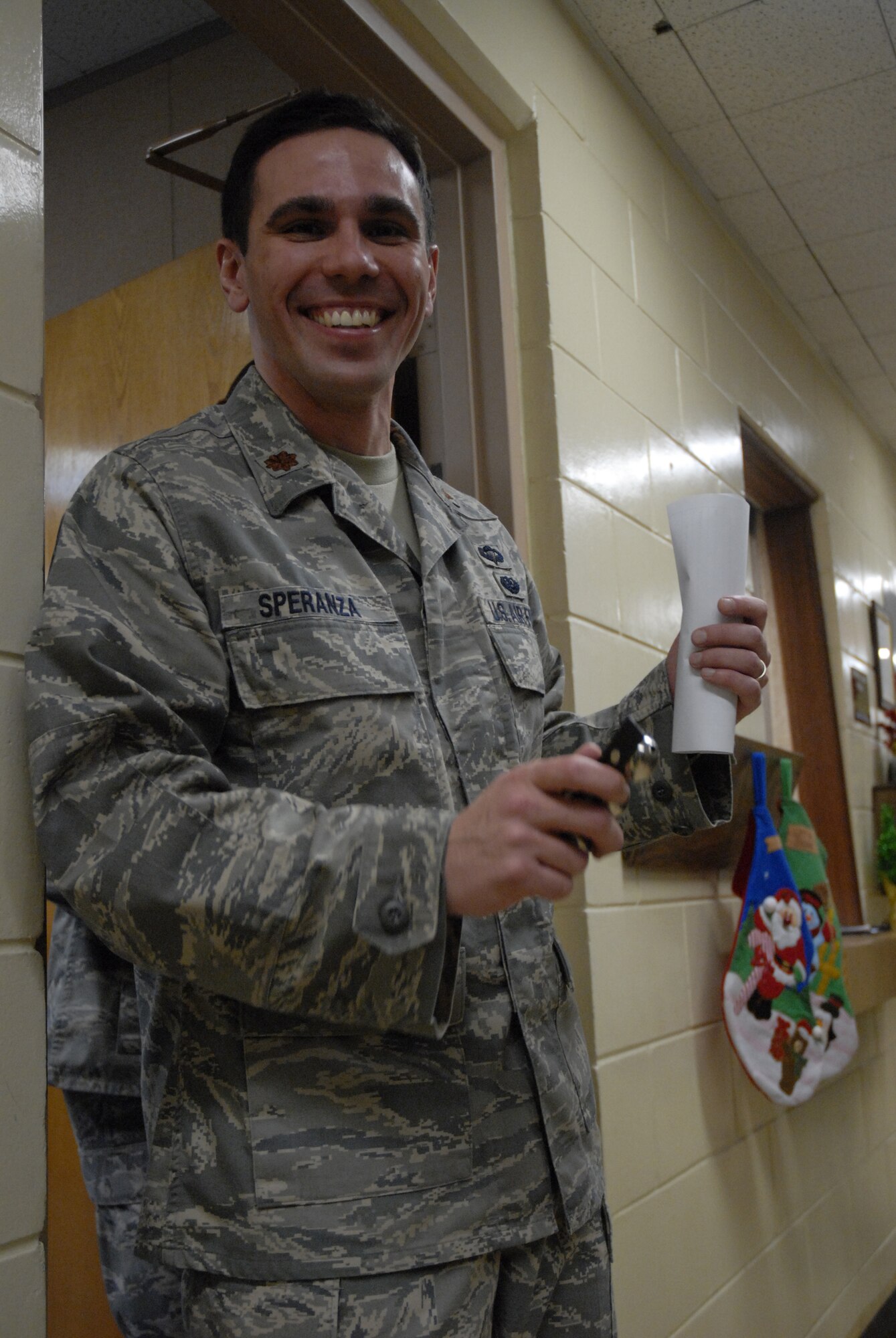 Maj. Shaun Speranza, Deputy Staff Judge Advocate at Kunsan Air Base, Republic of Korea, rings sleigh bells along to the music sung by the PACAF band, Pacific Trends, Dec. 11, 2008. Pacific Trends sang Christmas carols for the 8th Fighter Wing, the Republic of Korea Air Forces, the employees at Gunsan City Hall and the members of the Korean National Police. (U.S. Air Force Photo by SSgt Jason Colbert)