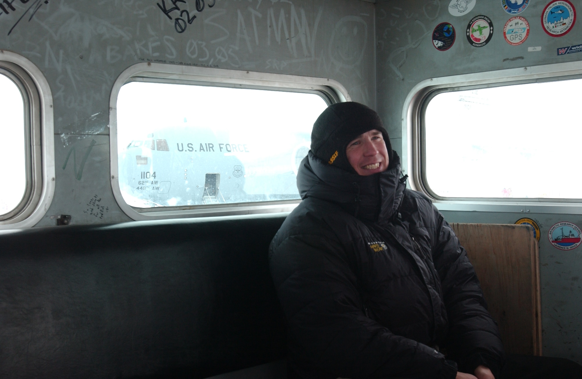 Capt. Joe O’Rourke, a pilot with the 7th Airlift Squadron deployed to Operation Deep Freeze, rides in a transport vehicle during a recent mission. (U.S. Air Force photo/Staff Sgt. Eric Burks)