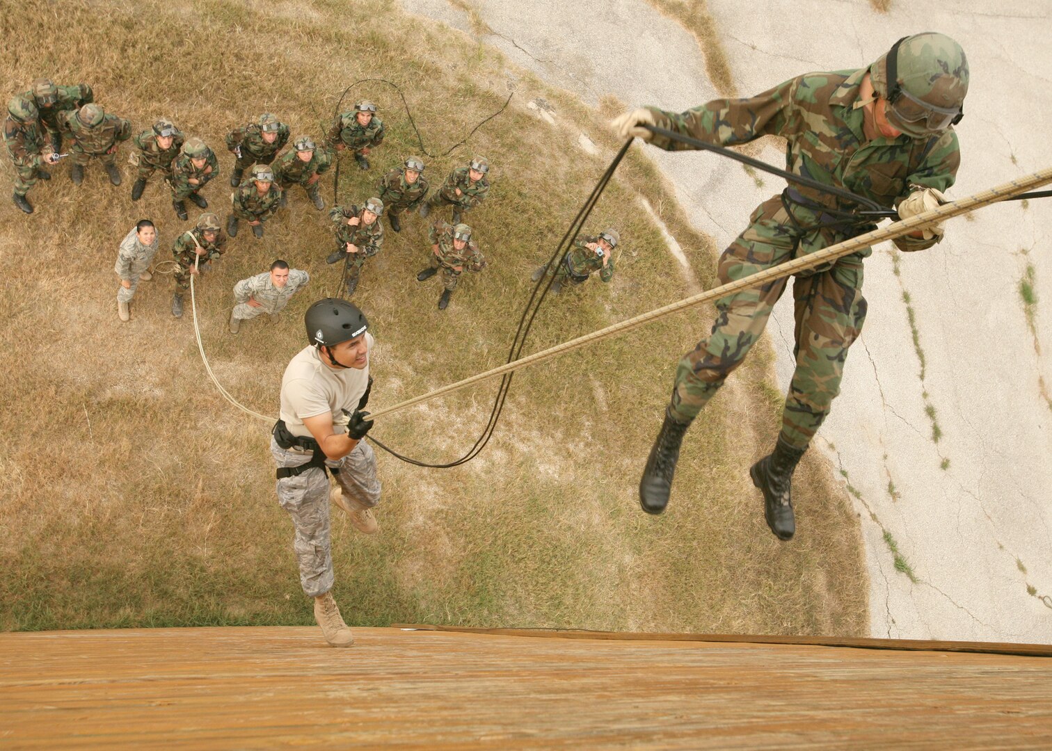 11/26/20008 - Capt. Carlos Hernandez guides Inter-American Air Forces Academy students down the rappelling wall during security forces training at Lackland Training Annex. IAAFA trains foreign military and police from Latin America in Spanish. Capt. Hernandez is with the 318th Training Squadron. (USAF photo by Robbin Cresswell)