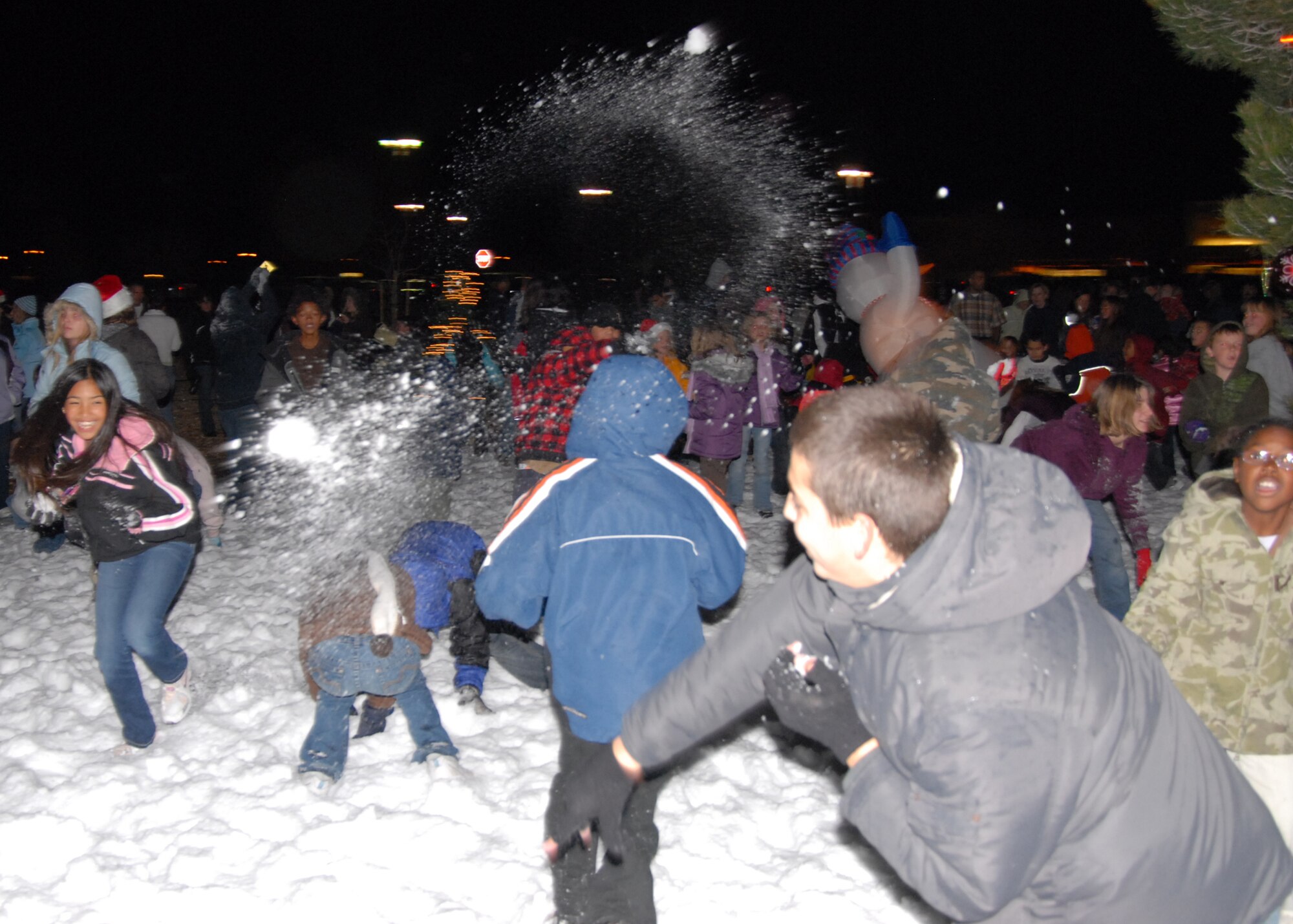Edwards children take part in a snow ball fight during theTree-Lighting Ceremony Dec. 10 in the Base Exchange parking lot. This was the 12th annual Tree Lighting Ceremony held on Edwards; more than 200 participants attended. (Airman 1st Class William O'Brien)