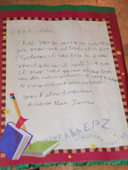 The holiday care packages put together by volunteers Dec. 6 as part of the 10th Annual Operation Happy Holidays included a hand made greeting card from local elementary school students like this one. (U.S. Air Force photo/Valerie Mullett)
