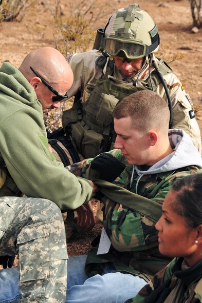 Pararescuemen rescue wounded survivors during a personnel recovery training exercise Dec. 7 at Davis-Monthan Air Force Base, Ariz.. More than 800 ground recovery personnel took part in Angel Thunder 2008, a combat search and rescue exercise. (U.S. Air Force photo/Senior Airman Noah R. Johnson) 