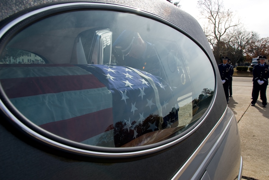 Members of the Maxwell-Gunter Honor Guard retrieve an empty casket from a hearse as part of the funeral demonstration at an Honor Guard Open House on Dec. 5. (Air Force photo by Jamie Pitcher)