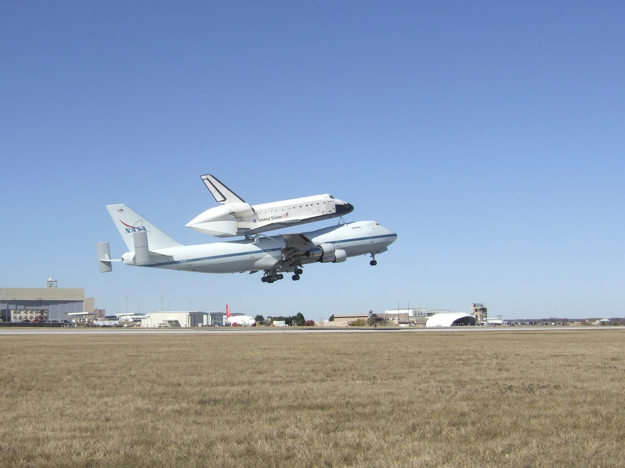 The Space Shuttle Endeavour and its Shuttle Carrier Aircraft/Orbital Vehicle (SCA/OV) takes off from Carswell Field on Naval Air Station, Joint Reserve Base, Fort Worth, Texas, after spending the night on Base. Carswell Field is the alternate landing location for the Space Shuttle due to its 1,200 ft runway. December 11, 2008 (USAF photo by Staff Sergeant Ivyann Castillo) 