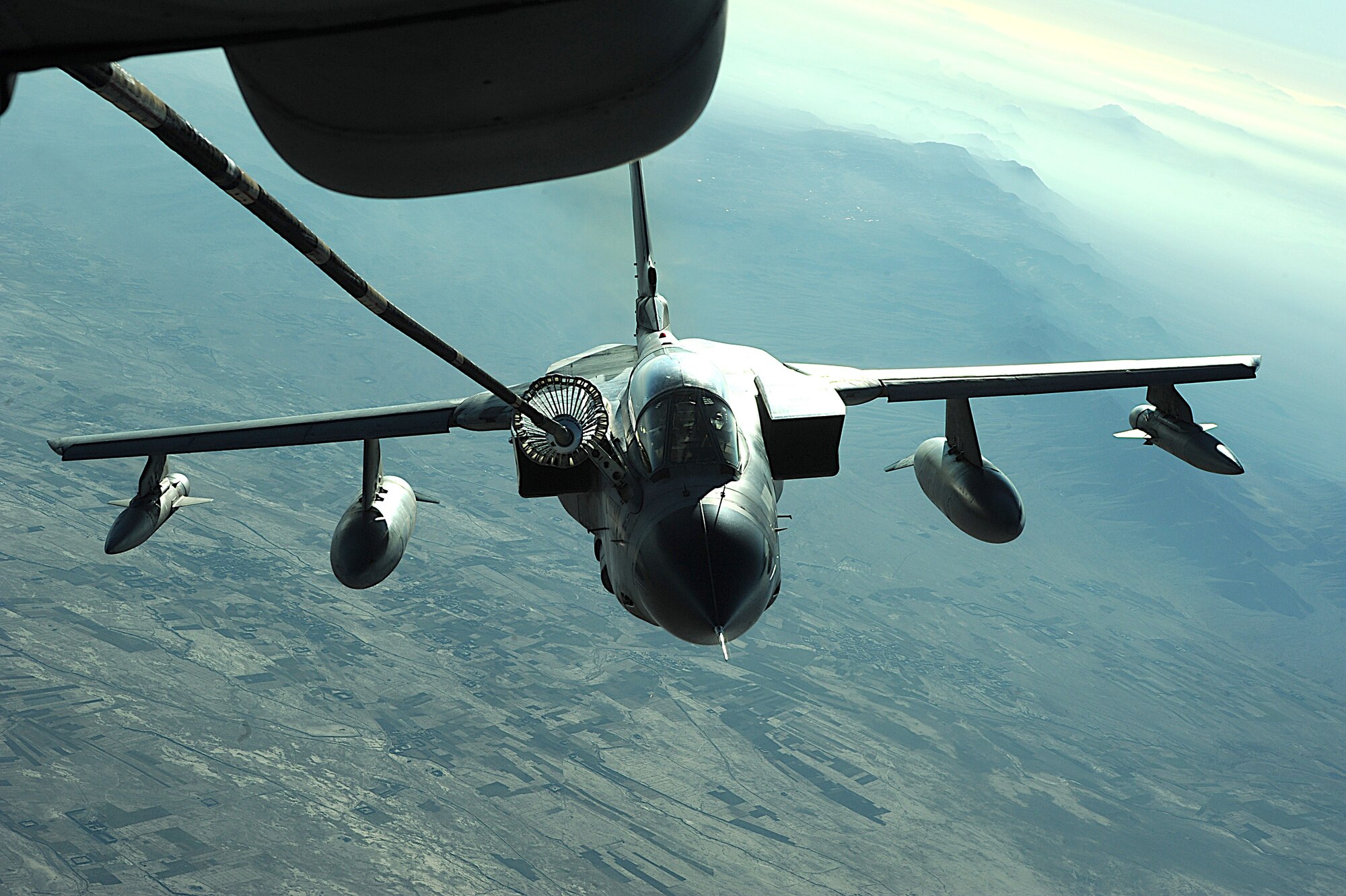A KC-10 Extender from the 908th Expeditionary Aerial Refueling Squadron refuels a Tornado Dec. 11 over Afghanistan. Using either an advanced aerial refueling boom, or a hose and drogue centerline refueling system, the KC-10 can refuel a wide variety of U.S. and allied military aircraft within the same mission. (U.S. Air Force photo/Staff Sgt. Aaron Allmon) 
