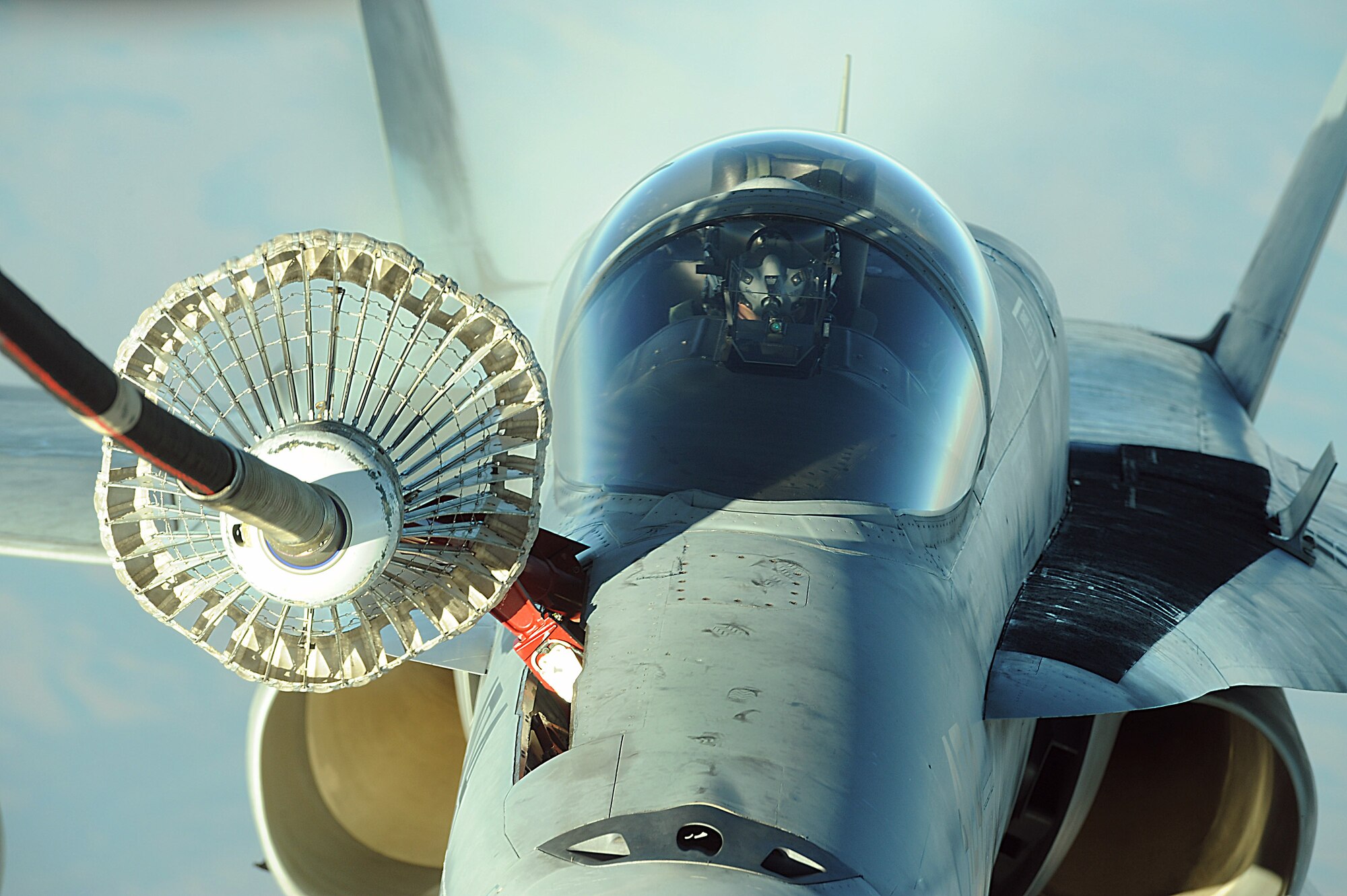 A KC-10 Extender from the 908th Expeditionary Aerial Refueling Squadron refuels a Navy F/A-18 Super Hornet Dec. 11 over Afghanistan. Using either an advanced aerial refueling boom, or a hose and drogue centerline refueling system, the KC-10 can refuel a wide variety of U.S. and allied military aircraft within the same mission. (U.S. Air Force photo/Staff Sgt. Aaron Allmon) 
