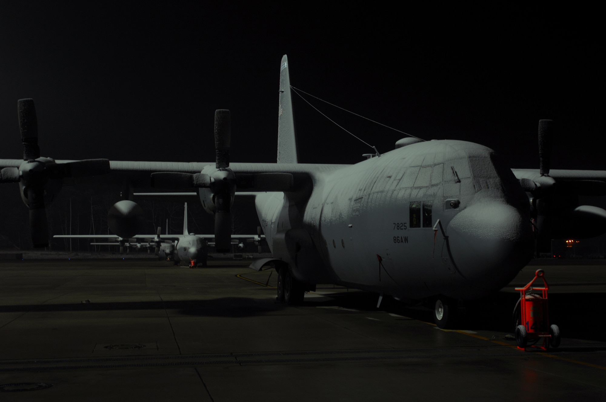 Several U.S. Air Force C-130 Hercules sit stacked on ramp six awiting de-icing, Dec. 10, 2008, Ramstein Air Base, Germany. The C-130 is one of the most used aircraft at Ramstein.  (U.S. Air Force photo Airman 1st Class Kenny Holston)