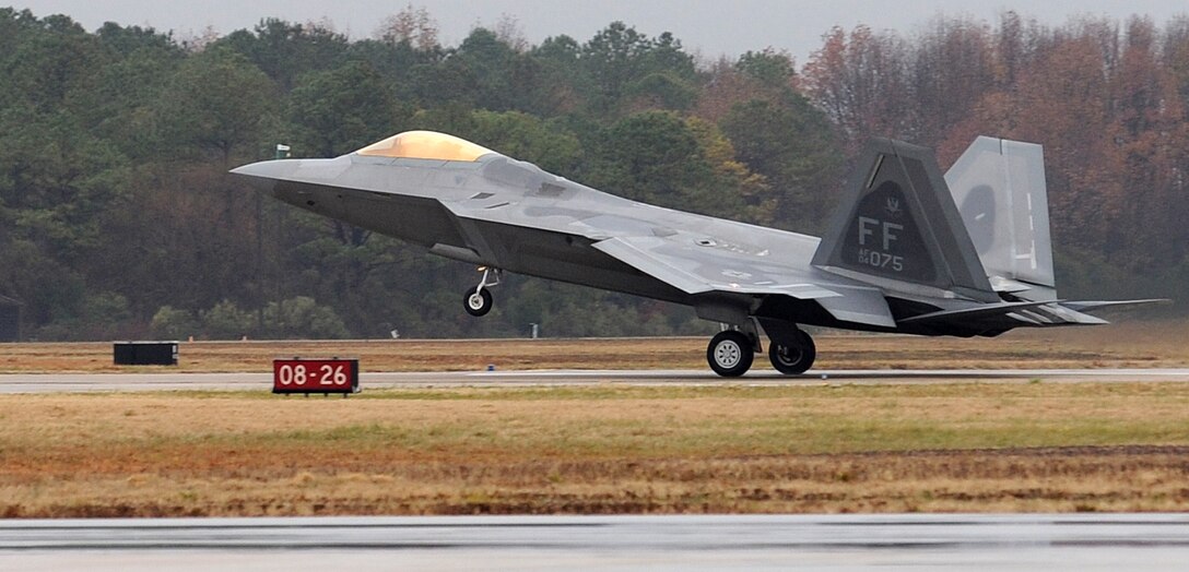 LANGLEY AIR FORCE BASE, Va. -- Lt. Col. Kevin Fesler, 94th Fighter Squadron commander, lands after completing his fini flight Dec. 11.  This flight was Colonel Fesler’s last flight on active duty before transitioning to the Air Force Reserve.  (U.S. Air Force photo/Airman 1st Class Zachary Wolf)
