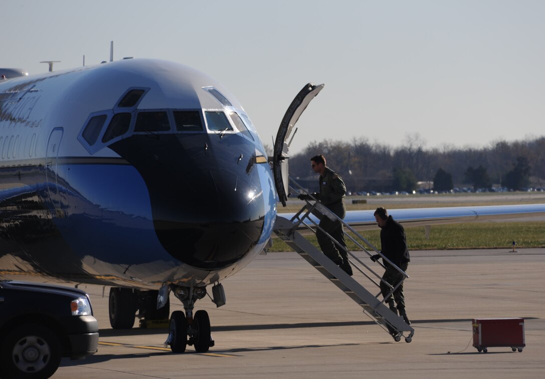 Stepping out...932nd Airlift Wing member prepare a plane for another mission on a crisp, cool, sunny morning.  The Air Force Reserve Command wing has three C-9C and three C-40C planes based at Scott Air Force Base, Ill.  (U.S. Air Force/Maj. Stan Paregien)