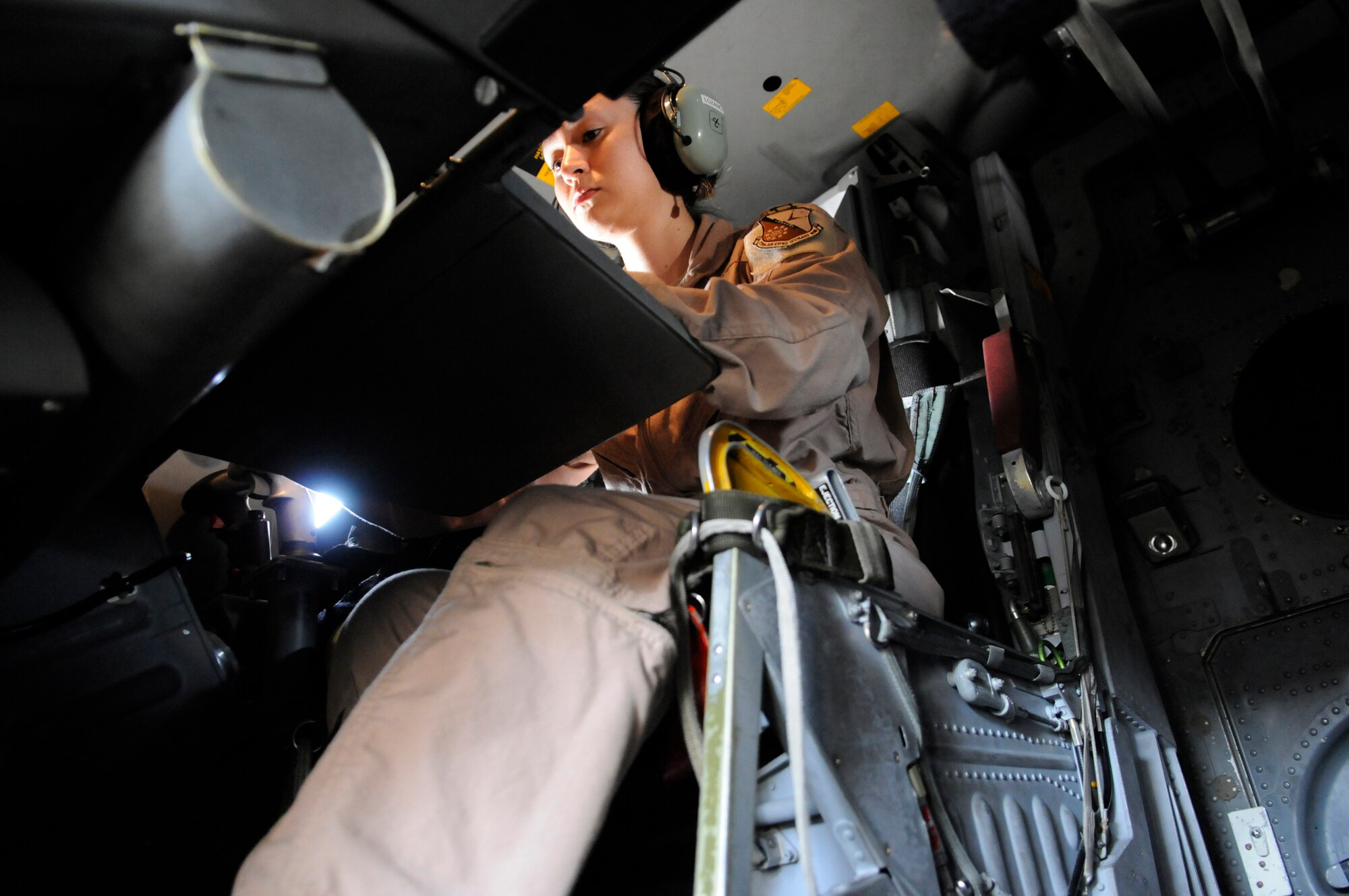 Capt. Daniela Lozano, a weapons systems officer assigned to the 34th Expeditionary Bomb Squadron, powers up her system and proceeds through the weapons system pre-flight checklist on a B-1, Dec. 9, 2008, at an undisclosed air base in Southwest Asia.  A pre-flight crew prepares the aircraft for flight in order to allow the crew actually flying to maximize their available flight time. Captain Lozano is a native of Dallas, Texas, and is deployed from Ellsworth Air Force Base, S.D.  She is deployed in support of Operations Iraqi and Enduring Freedom and Joint Task Force-Horn of Africa.  (U.S. Air Force photo by Tech. Sgt. Michael Boquette)