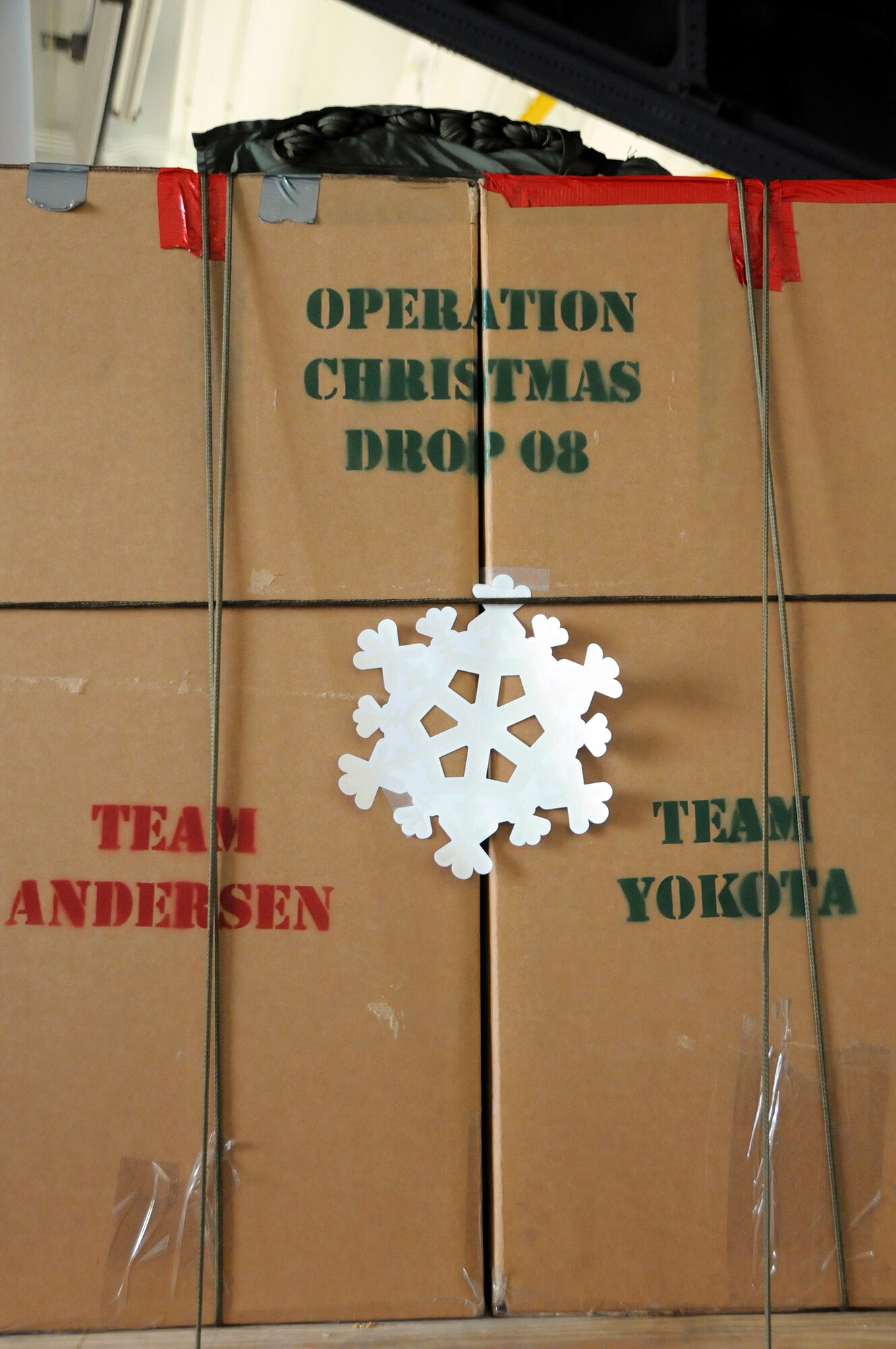 ANDERSEN AIR FORCE BASE, Guam - The longest-running humanitarian air drop mission in history, Operation Christmas Drop kicked off the season with a push ceremony here Dec. 12. Team Andersen collaborated with Yokota Air Base, Japan for the 57th year in a row. (U.S. Air Force Base photo by Airman First Class Courtney Witt)