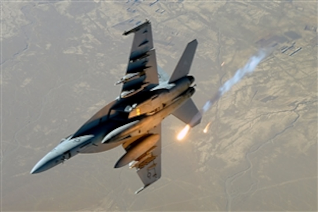 A U.S. Navy F-18E/F Super Hornet aircraft deploys flares during a combat patrol over Afghanistan, Dec. 10, 2008.