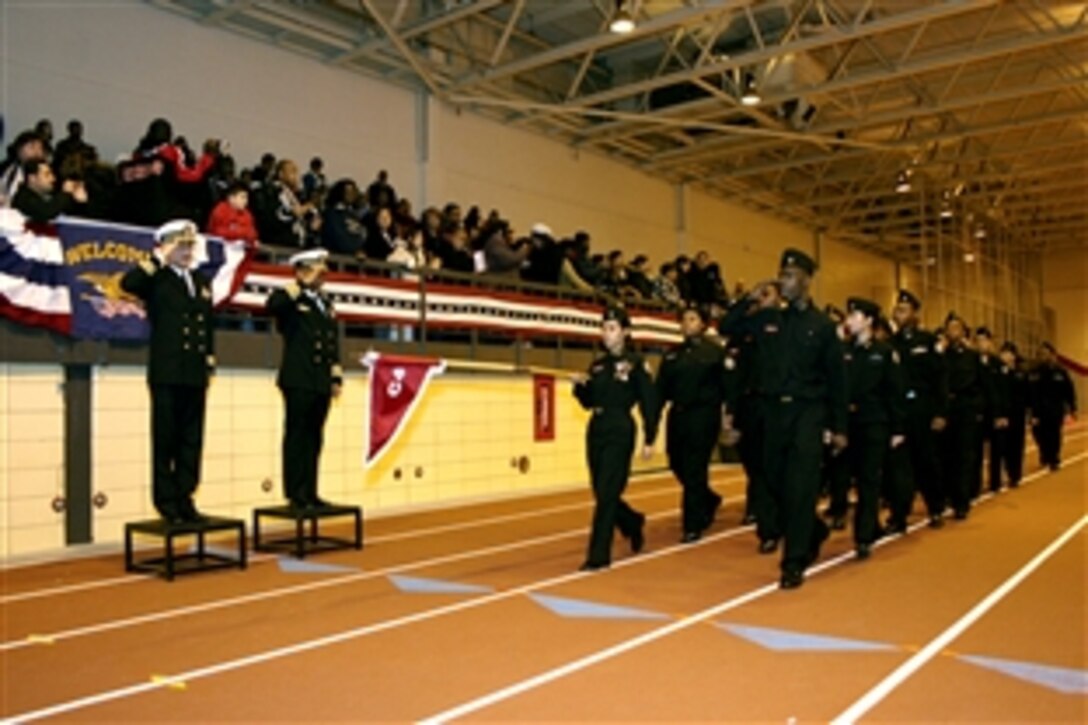 U.S. Navy Capt Jake Washington, commanding officer of Naval Facilities Engineering Command Midwest, serves as reviewing officer during a pass-in-review by Navy Junior Reserve Officer Training Corps cadets at Proviso West High School, Hillside, NY., Dec. 5, 2008. Washington served as reviewing officer during a formal unit inspection and encouraged the battalion's 335 cadets to remain dedicated to being good citizens and to continue making positive choices for their future.