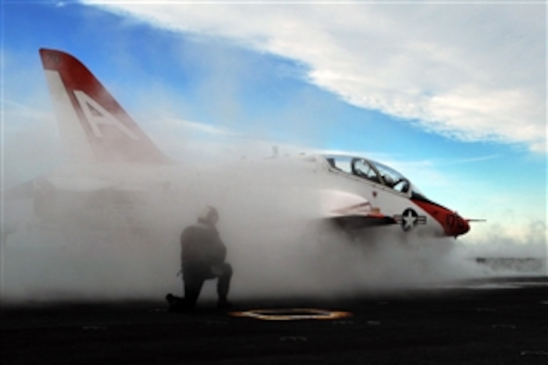 A T-45 Goshawk aircraft assigned to Carrier Training Wing 1 is readied for launch from the No. 1 steam-powered catapult on the flight deck of the Nimitz-class aircraft carrier USS Abraham Lincoln in the Pacific Ocean, Dec. 11, 2008. Lincoln is conducting training and carrier qualifications.
