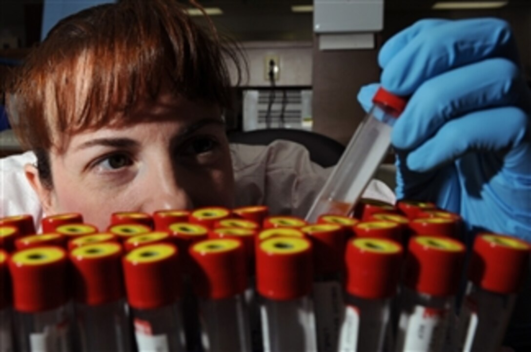 U.S. Air Force Tech. Sgt. Tracy Stewart, from the 28th Medical Support Squadron, verifies patient identification on blood samples at Ellsworth Air Force Base, S.D., on Dec. 10, 2008.  