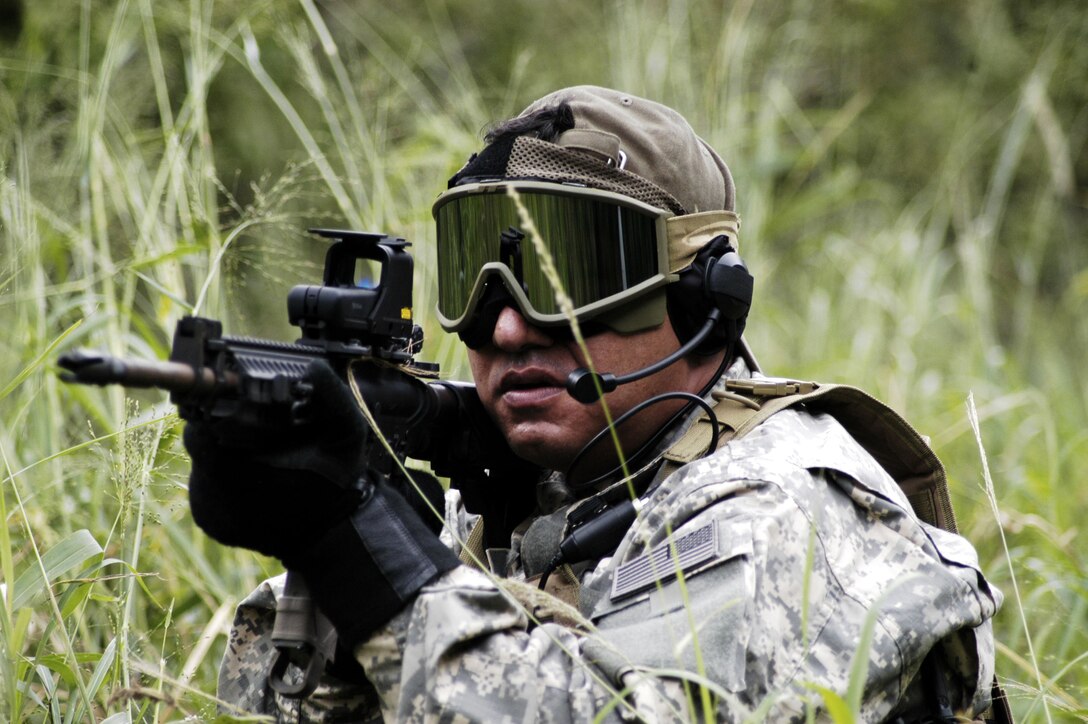 KANEOHE, Hawaii -- Jason Wright, a former soldier and airsoft enthusiast, prepares to take down an enemy during a military simulation exercise held by Double Tap, an airsoft organization founded by Marines and sailors of U.S. Marine Corps Forces, Pacific. Members of the Hawaii airsoft community were invited to take on the members of Double Tap in a series of combat scenarios.