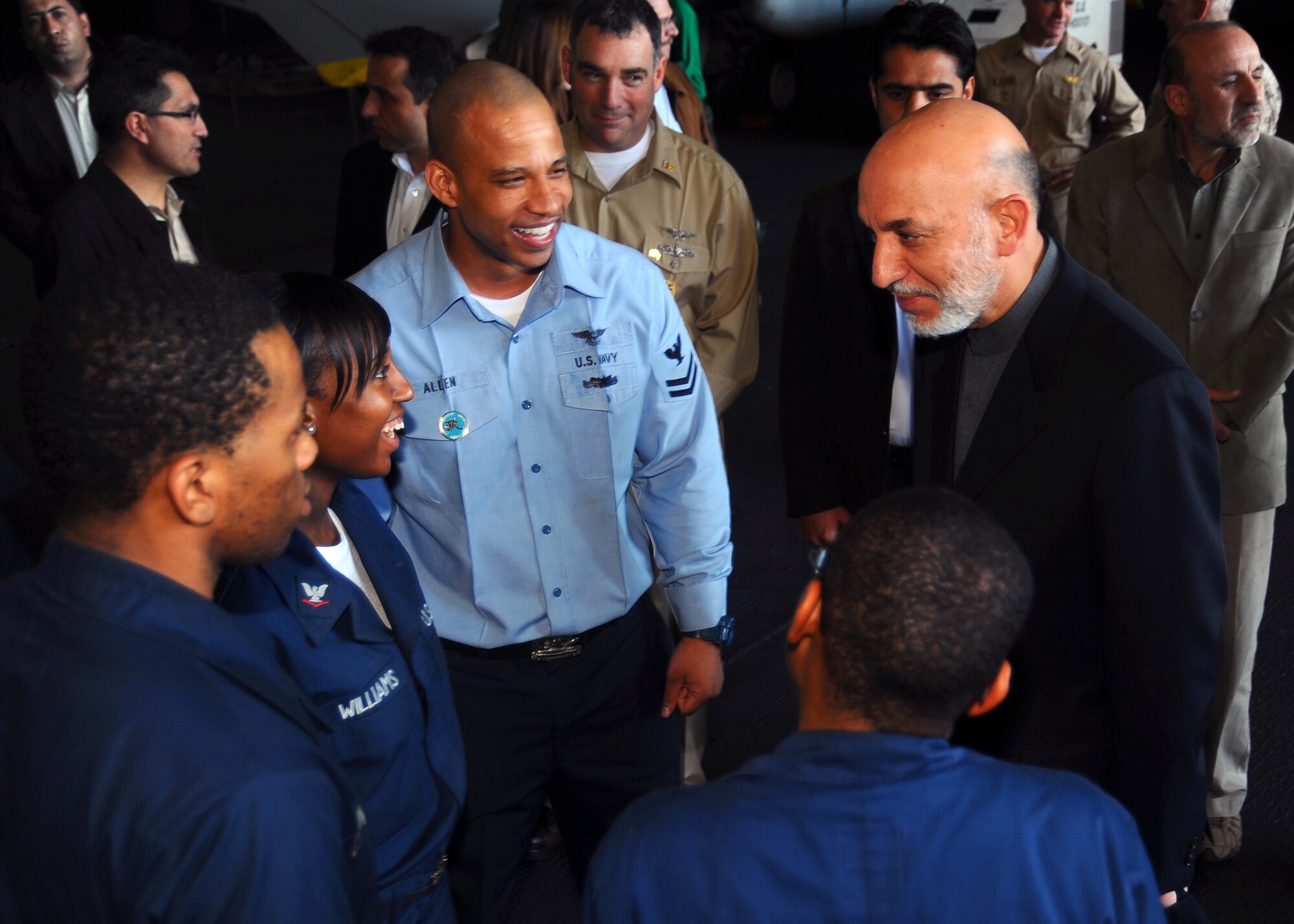 Hamid Karzai, President of the Islamic Republic of Afghanistan, addresses Sailors in the hangar bay aboard USS Theodore Roosevelt (CVN 71).  Karzai visited the aircraft carrier to gain a better understanding of how the U.S. Navy conducts operations at sea.  Theodore Roosevelt and embarked Carrier Air Wing (CVW) 8 are on deployment in the 5th Fleet area of operations, and are focused on reassuring regional partners of the United States' commitment to security, which promotes stability and global prosperity (U.S. Navy photo by Mass Communication Specialist 3rd Class Antwjuan Richards-Jamison /Released)