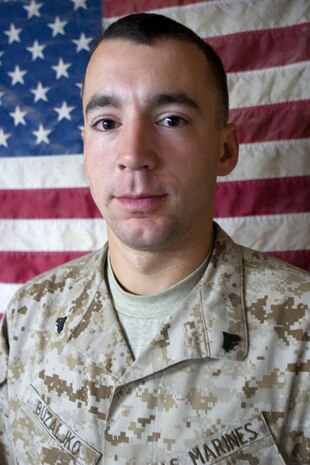 Cpl. Bajro Buzaljko, a 21-year-old ammunition technician from Utica, N.Y., with Task Force 1st Battalion, 3rd Marine Regiment, Regimental Combat Team 1, poses for a photo in Karmah, Iraq, Dec. 12. Buzaljko left war-torn Bosnia as a child after watching his hometown fall victim to civil war. After the attacks of Sept. 11, he felt his home was yet again being attacked and decided to join the Marine Corps to defend his country.