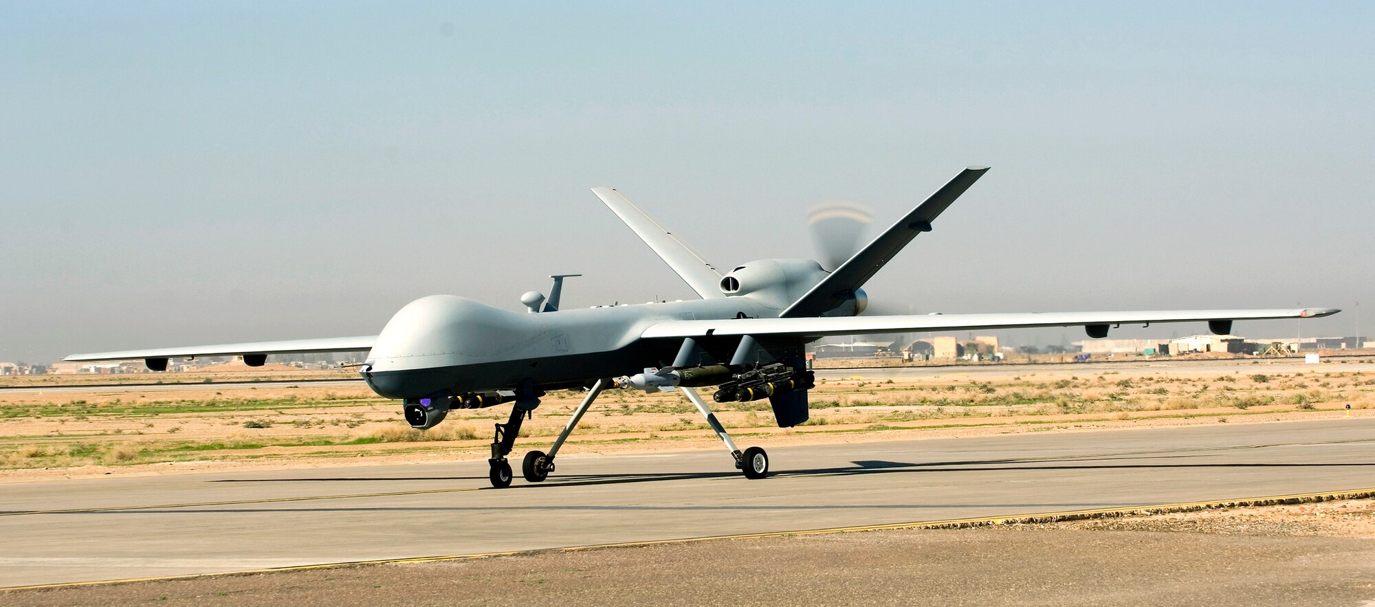 An MQ-9 Reaper unmanned aircraft taxies after landing at Joint Base Balad, Iraq. Reapers are remotely piloted and can linger over battlefields, providing persistent strike capabilities to ground force commanders. This Reaper is deployed to the 46th Expeditionary Reconnaissance and Attack Squadron from Creech Air Force Base, Nev.  (U.S. Air Force photo/Tech. Sgt. Erik Gudmundson)