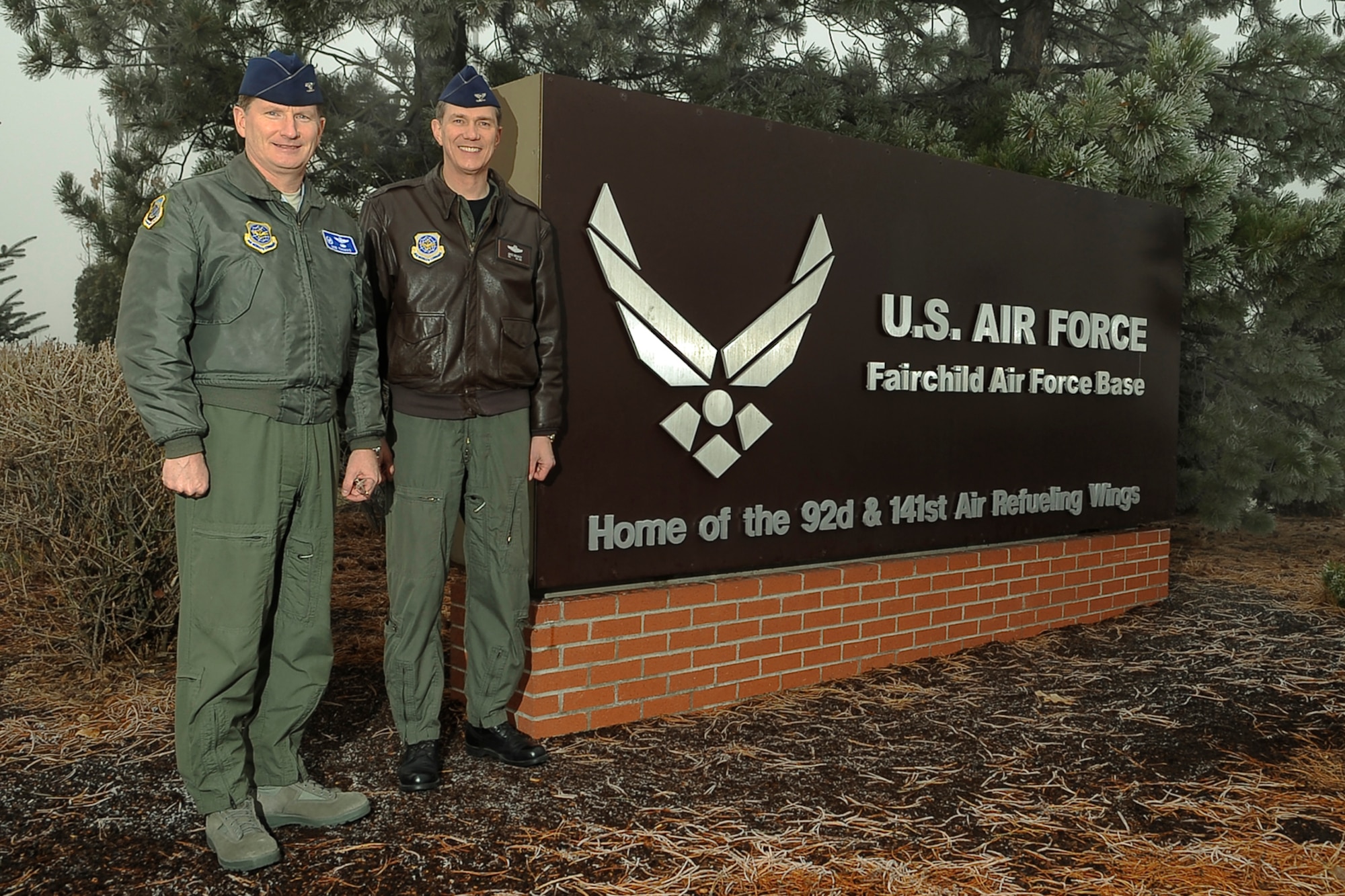 FAIRCHILD AIR FORCE BASE, Wash. – Commanders from the 92nd Air Refueling Wing and the 141st Air Refueling Wing, Col. Robert Thomas and Col. Gregory Bulkley, respectively, pose in front of the new main gate sign commemorating the union of the 92nd and 141st ARWs here Dec. 11. Despite numerous name changes over the years, the 92nd has called Fairchild Air Force Base home; the 141st, one of the nation’s oldest Air National Guard flying units, has been stationed in the Spokane area since 1924. (U.S. Air Force photo / Senior Airman Joshua Chapman)