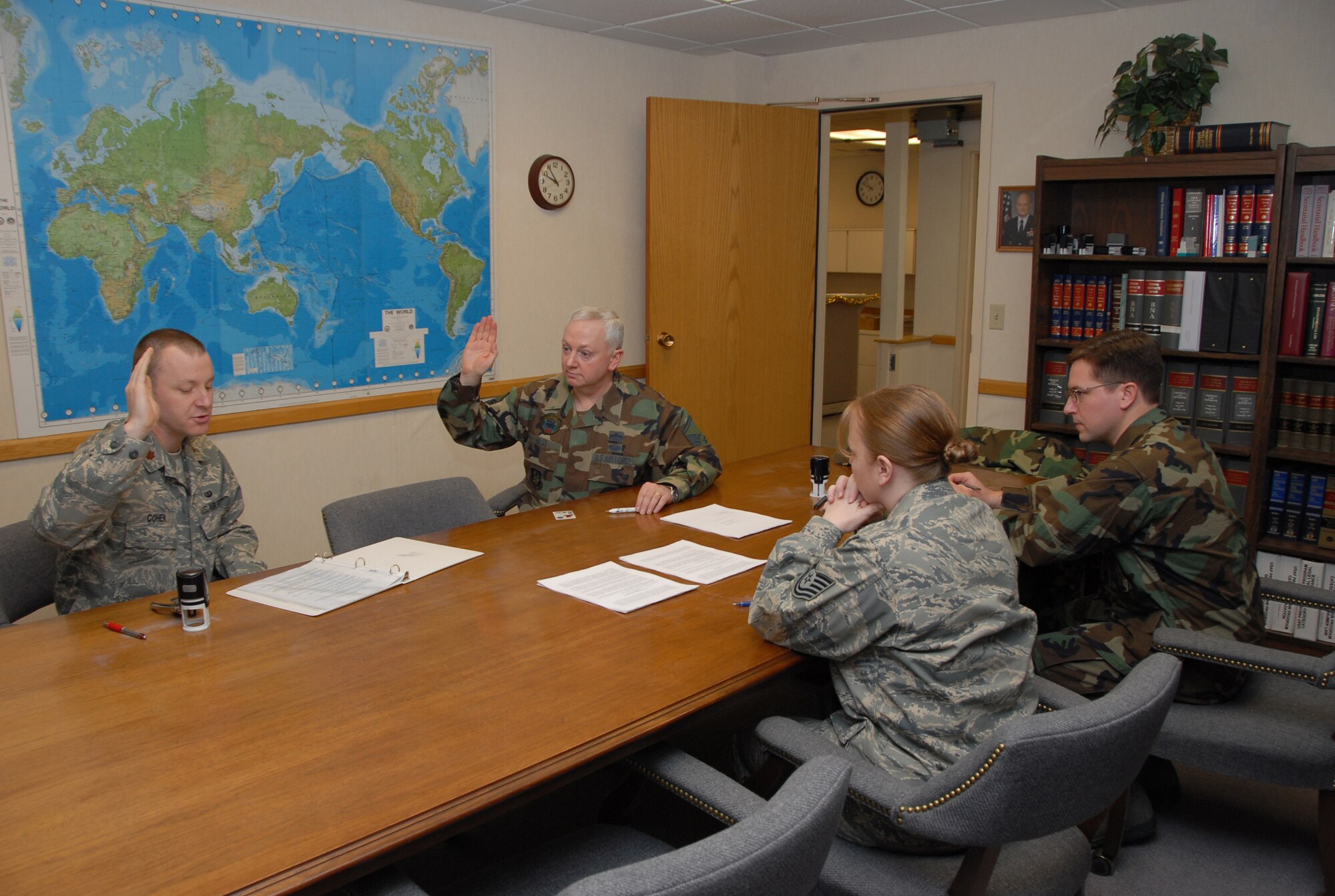 Master Sgt. Cameron Hess, 477th Civil Engineer Squadron, verifies information for the 3rd Wing JAG prior to signing his will. The 477th CES will deploy to Iraq in the spring. This will be the first combat deployment for the squadron since World War II.  The 477th CE mission is to help plan, build, sustain and protect the base while providing combat-ready, deployable forces. (U.S. Air Force Photo by Staff Sgt. Rhiannon Willard)
