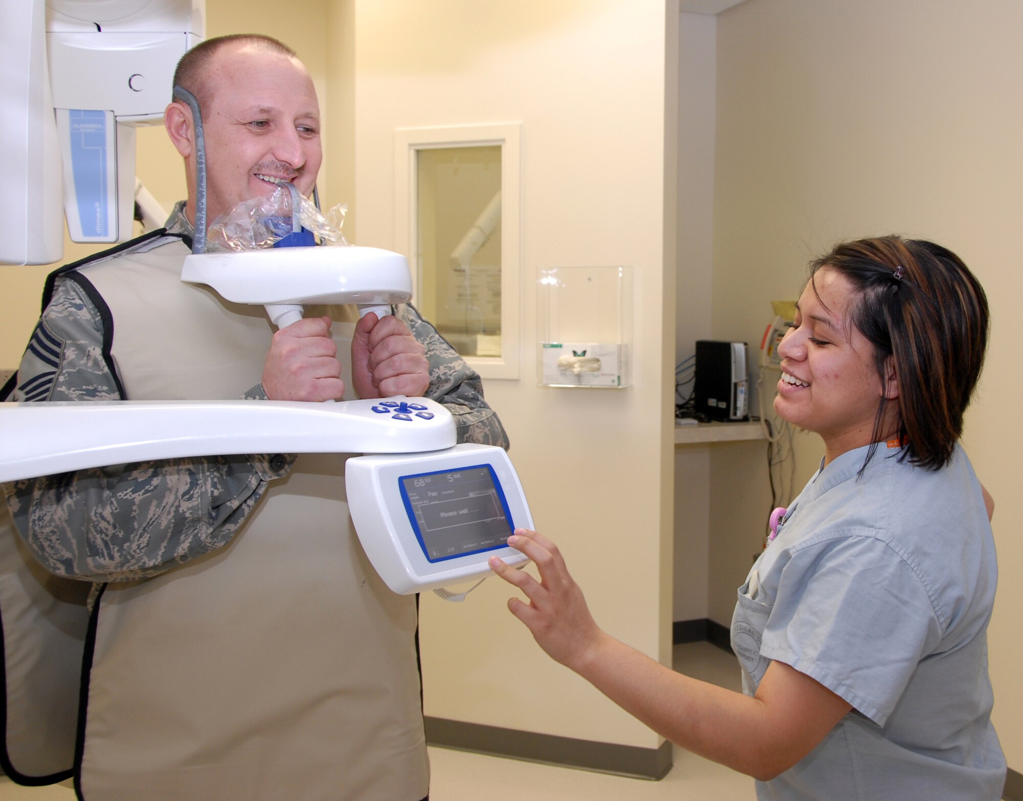 Chief Master Sgt. Russell Robinson, 477th Maintenance Squadron, follows specific instructions given by Staff Sgt. Irma Meza-Orozco, during a routine dental x-ray at the 3rd Medical Group on December 13.  The 477th Fighter Group is a Classic Associate unit responsible for recruiting, training, developing and retaining Citizen Airmen to support 3rd Wing and Expeditionary Air Force mission requirements. (U.S. Air Force photo by Staff Sgt. Rhiannon Willard)
